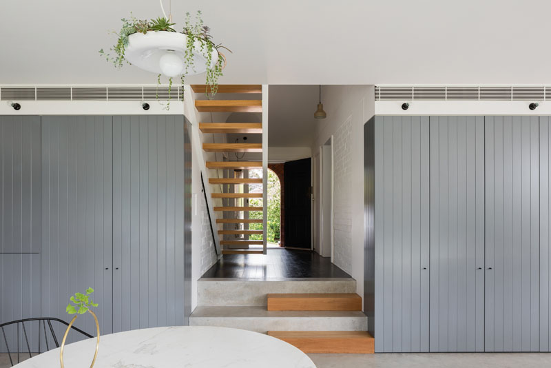 Looking back toward the original part of the home, concrete and wood steps lead to the main floor.