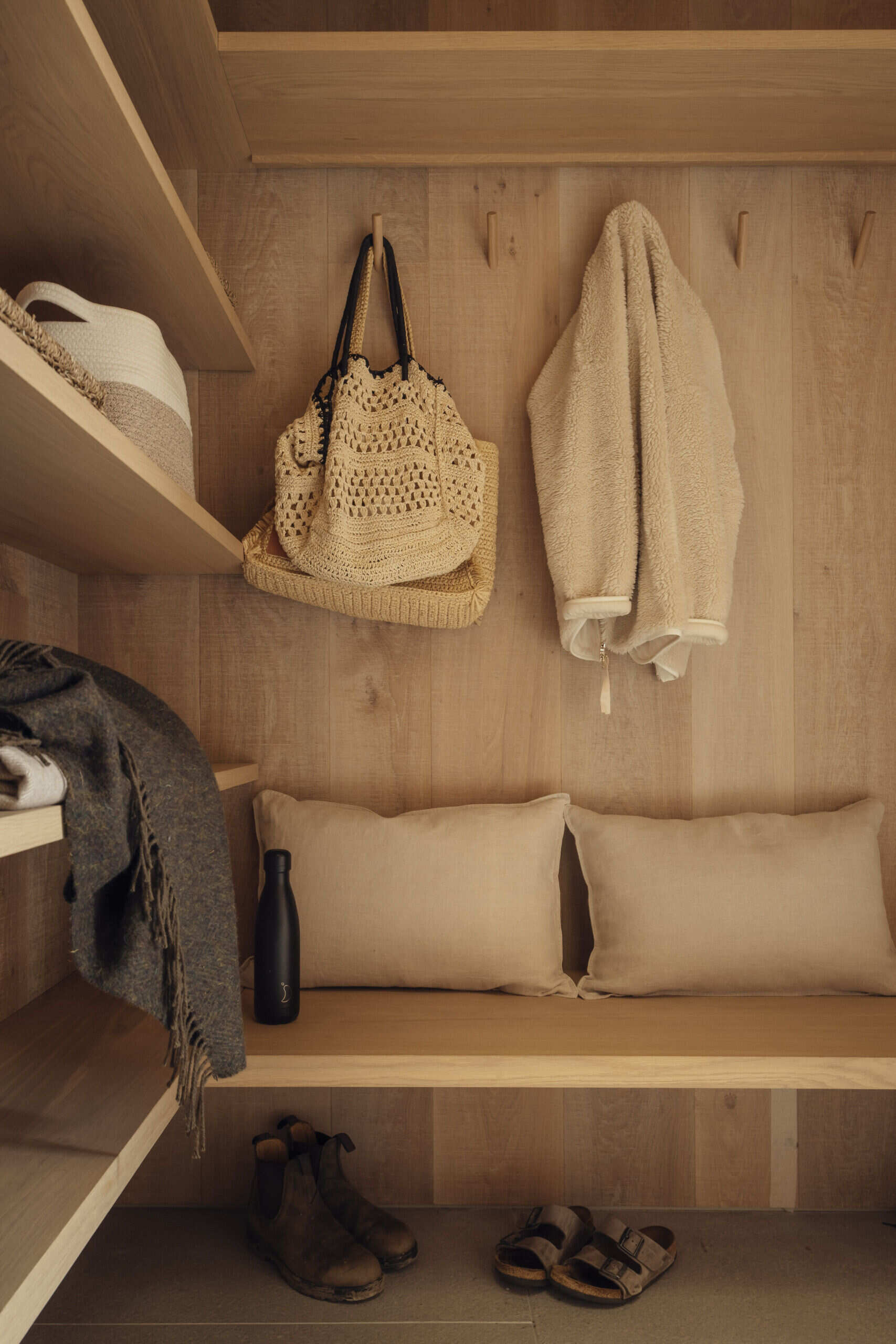 Essential for a family of surfers and cyclists, the mudroom and garage handle the mess of outdoor life. These functional spaces are deliberately separated from the main living areas, keeping the heart of the home serene.