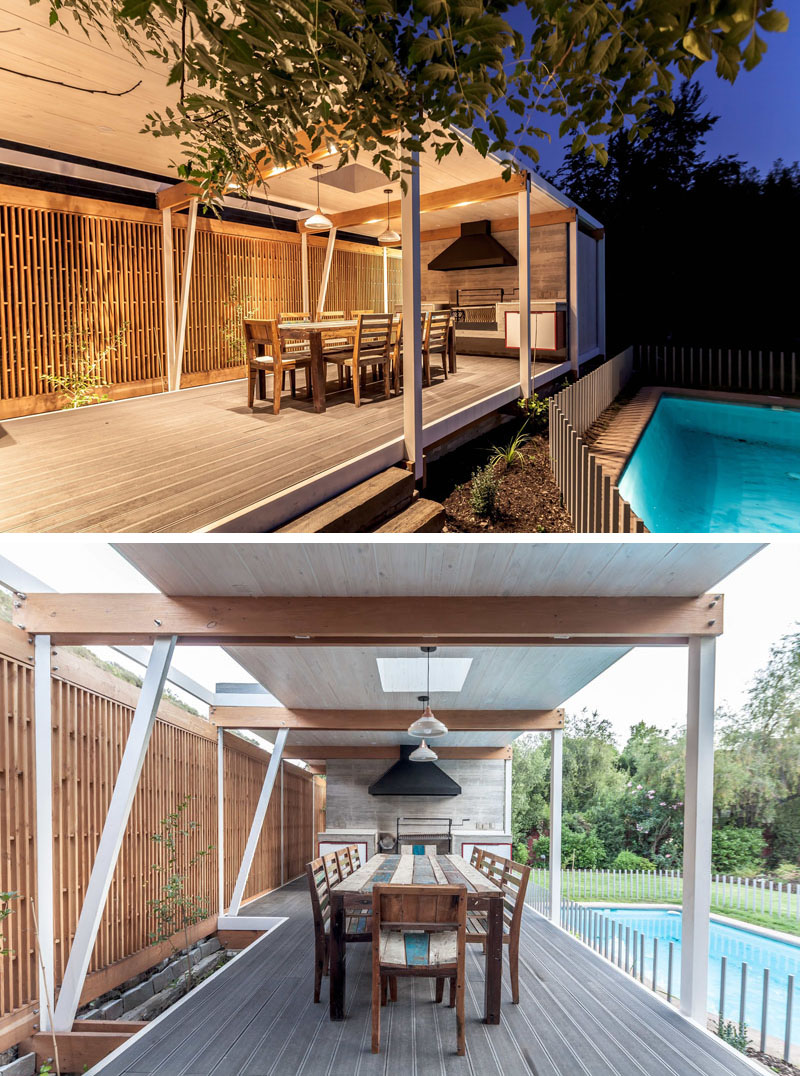 Simple outdoor sofas arranged at one end of this modern pool house frame views of the pool and backyard, while a spacious dining table and BBQ area is designed for gatherings, softened by wooden screens that filter sunlight while adding privacy.