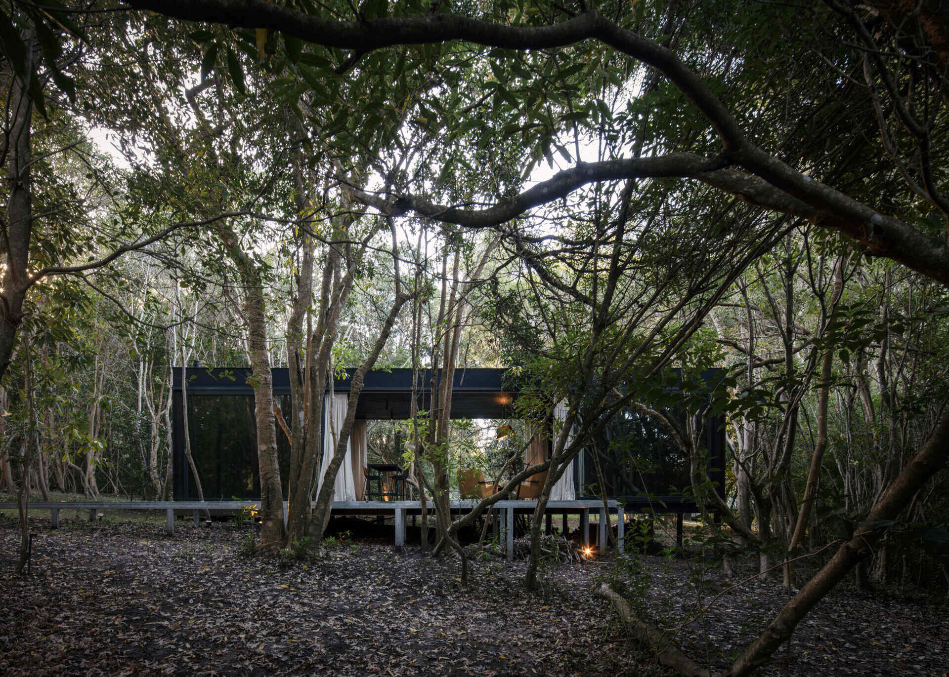 Prefabricated with precision, this small home sits lightly on the terrain, leaving the natural setting untouched.