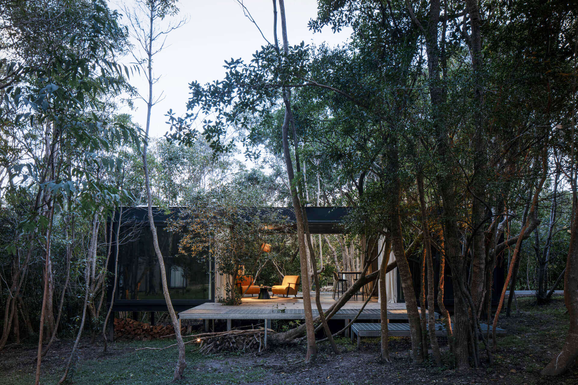 Prefabricated with precision, this small home sits lightly on the terrain, leaving the natural setting untouched.
