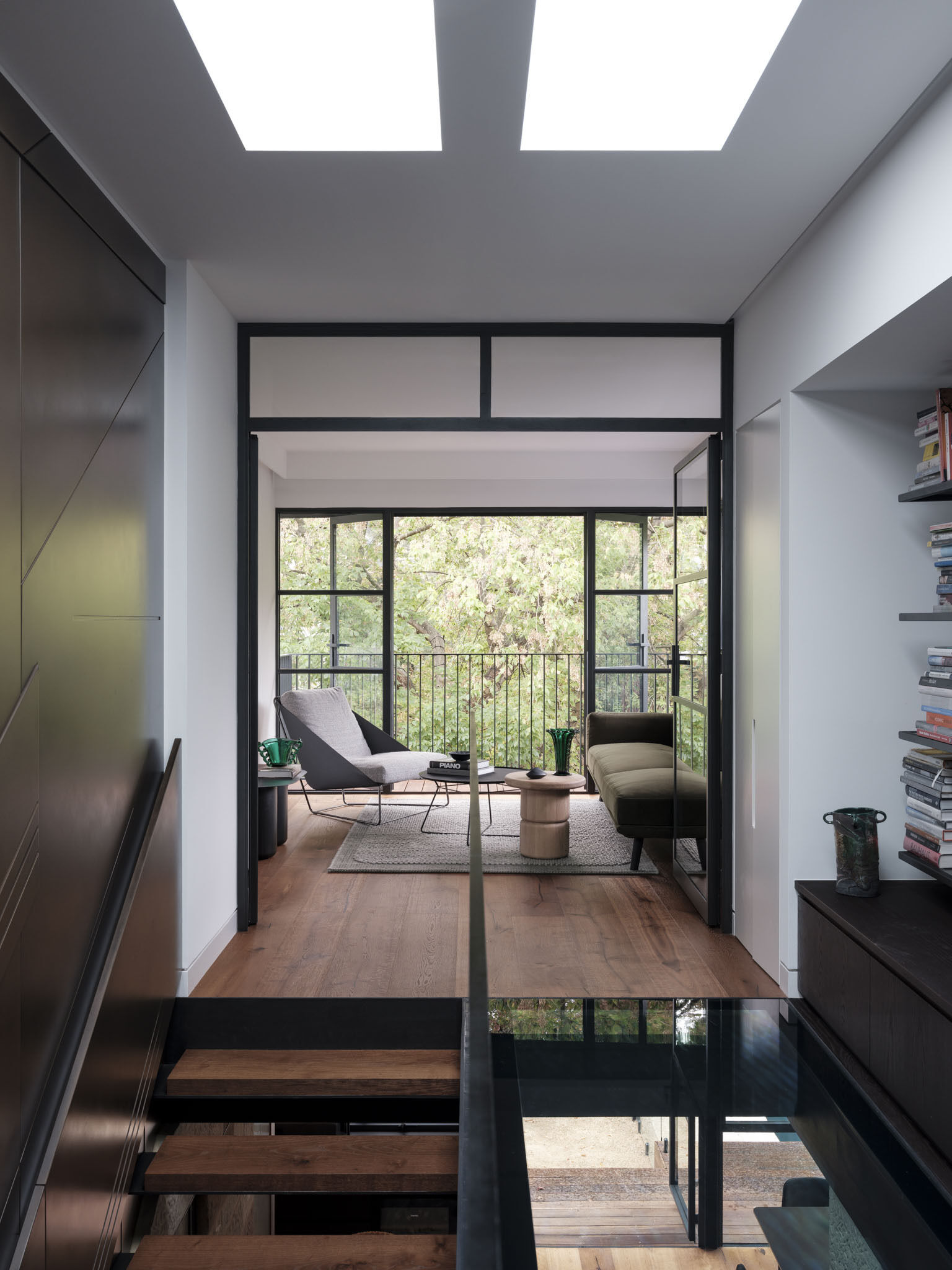 The upstairs sitting room benefits directly from the stair’s repositioning. Daylight now pours into the space, with framed views that connect it to both inside and out. This room demonstrates how reorganization, rather than expansion, can enhance livability.
