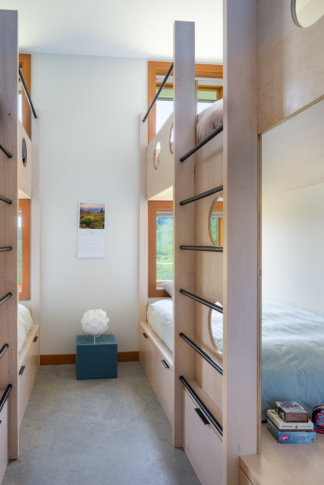 A bunk room adds functional comfort, making this off-grid cabin ideal for hosting family and friends.