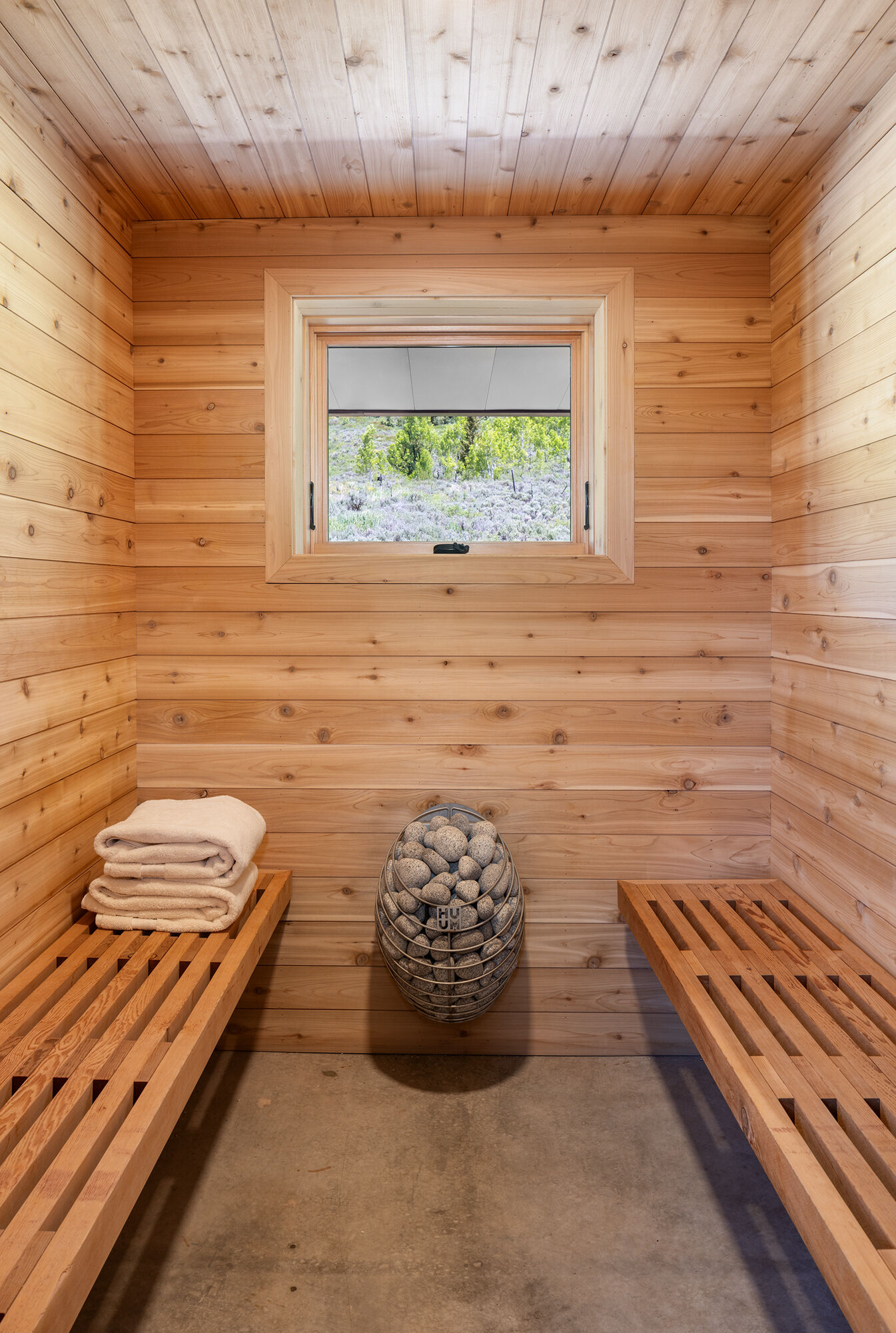 A private sauna inside this cabin combines wellness and practicality in this off-grid mountain home.