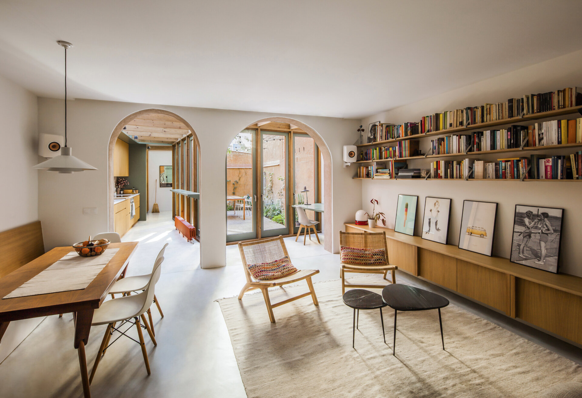 Built-in shelving and cabinetry adds function and character to this living space, while simple seating keeps it open.