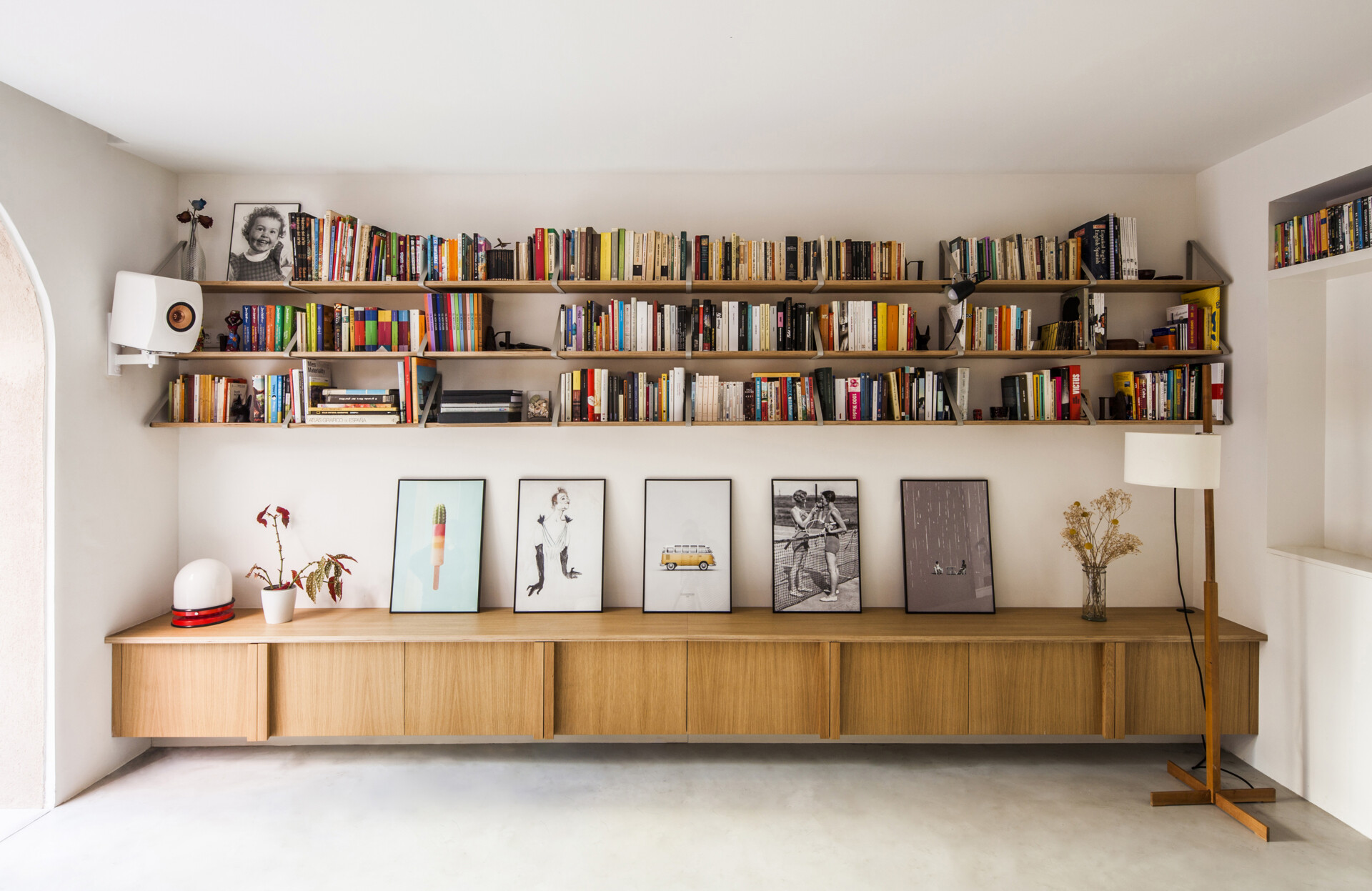 Built-in shelving and cabinetry adds function and character to this living space, while simple seating keeps it open.