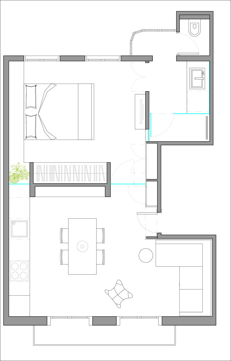 This floor plan shows how the living, dining, and kitchen areas connect seamlessly, while the bedroom and bathroom remain private. Each element was designed to make small-space living feel open and cohesive.
