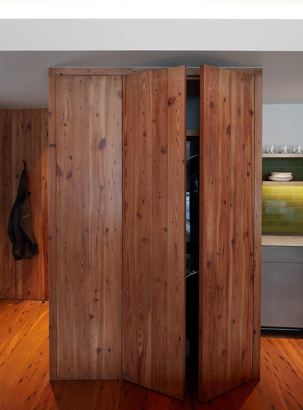 Inside the guest house, natural light, living room, and a small kitchen make the space both bright and practical.