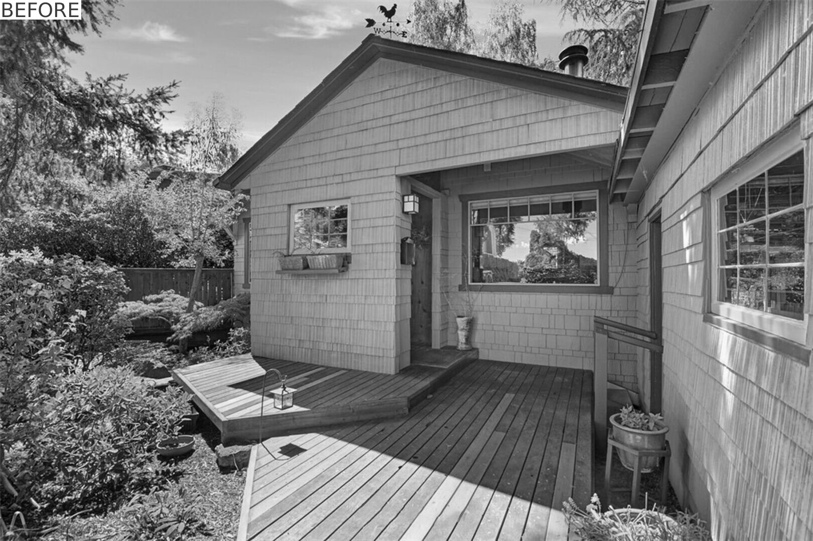 BEFORE - See how a bright teal addition transformed the street view of this 1919 Seattle home while preserving its historic layers.