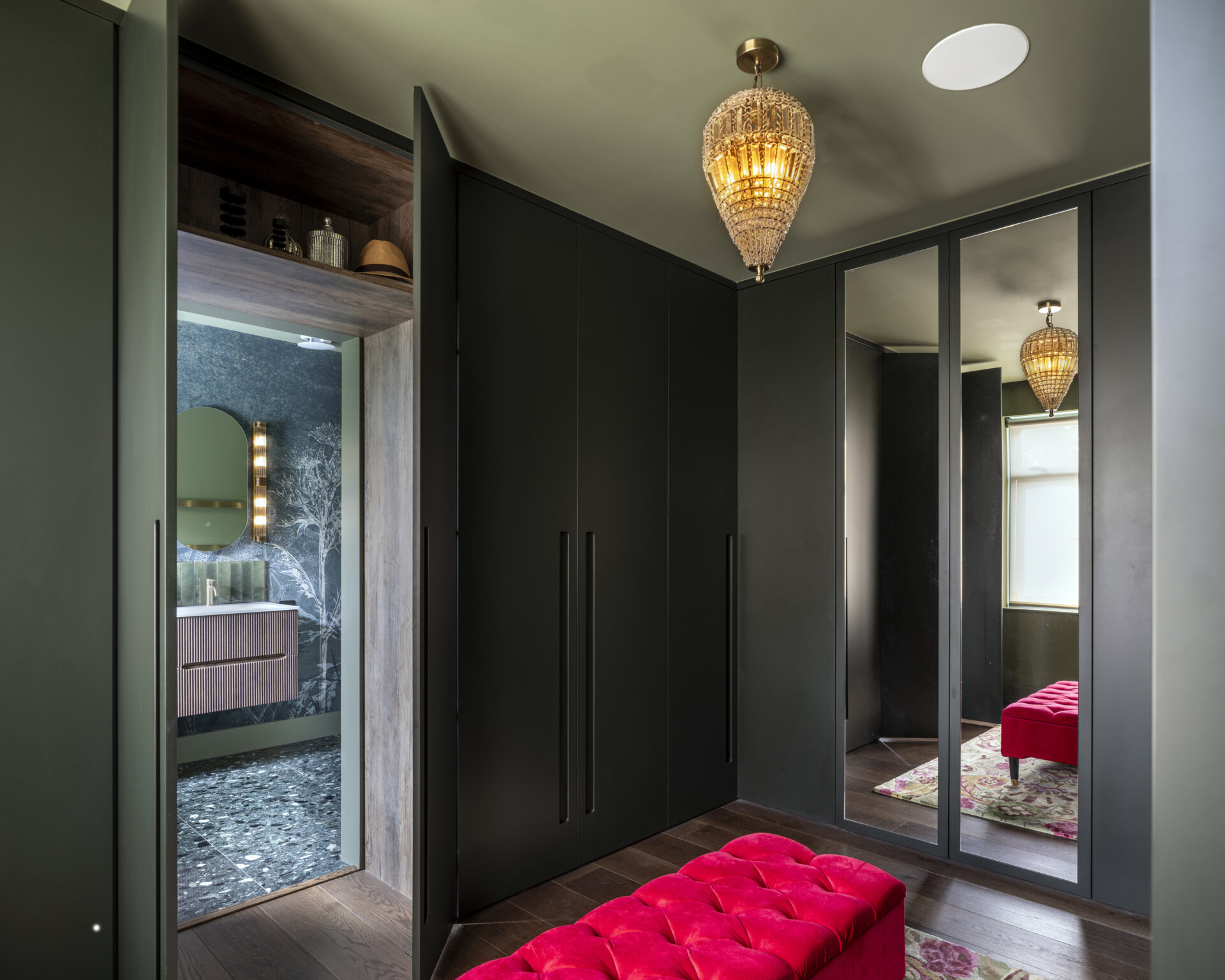 The main bedroom suite embodies comfort and calm. A walk-through closet leads to a serene ensuite bathroom, finished in soft tones that complement the home’s palette.