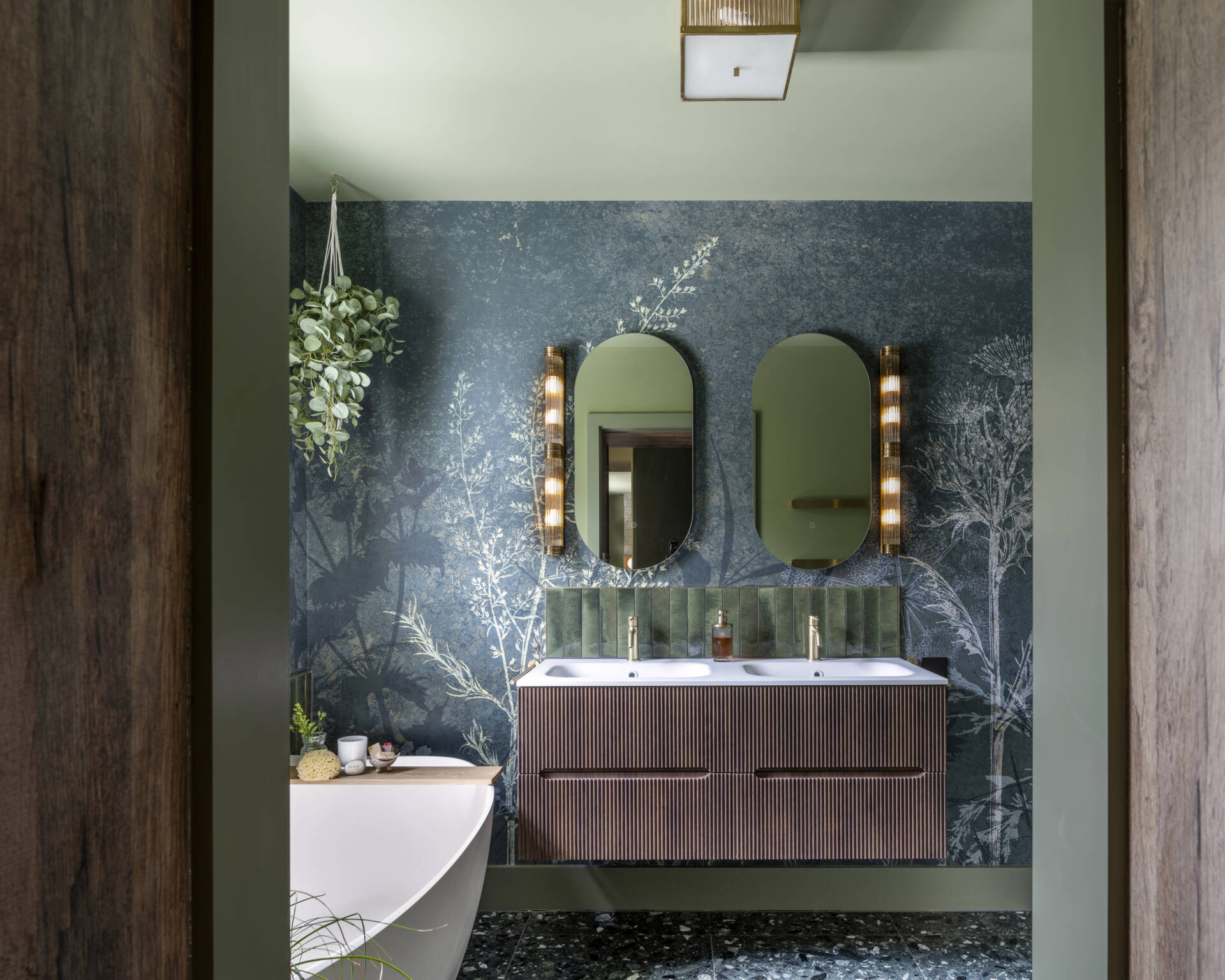 The main bedroom suite embodies comfort and calm. A walk-through closet leads to a serene ensuite bathroom, finished in soft tones that complement the home’s palette.