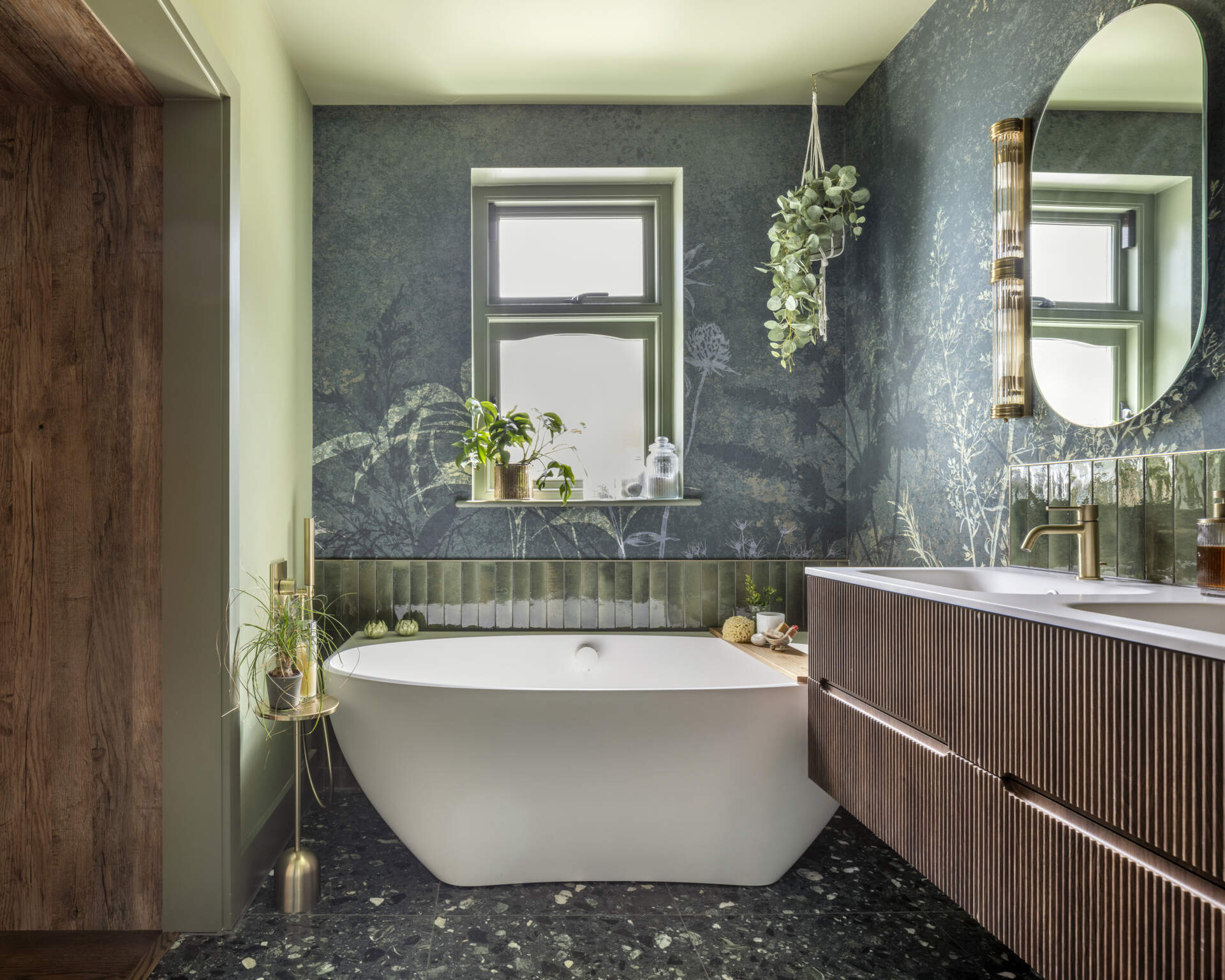 The main bedroom suite embodies comfort and calm. A walk-through closet leads to a serene ensuite bathroom, finished in soft tones that complement the home’s palette.