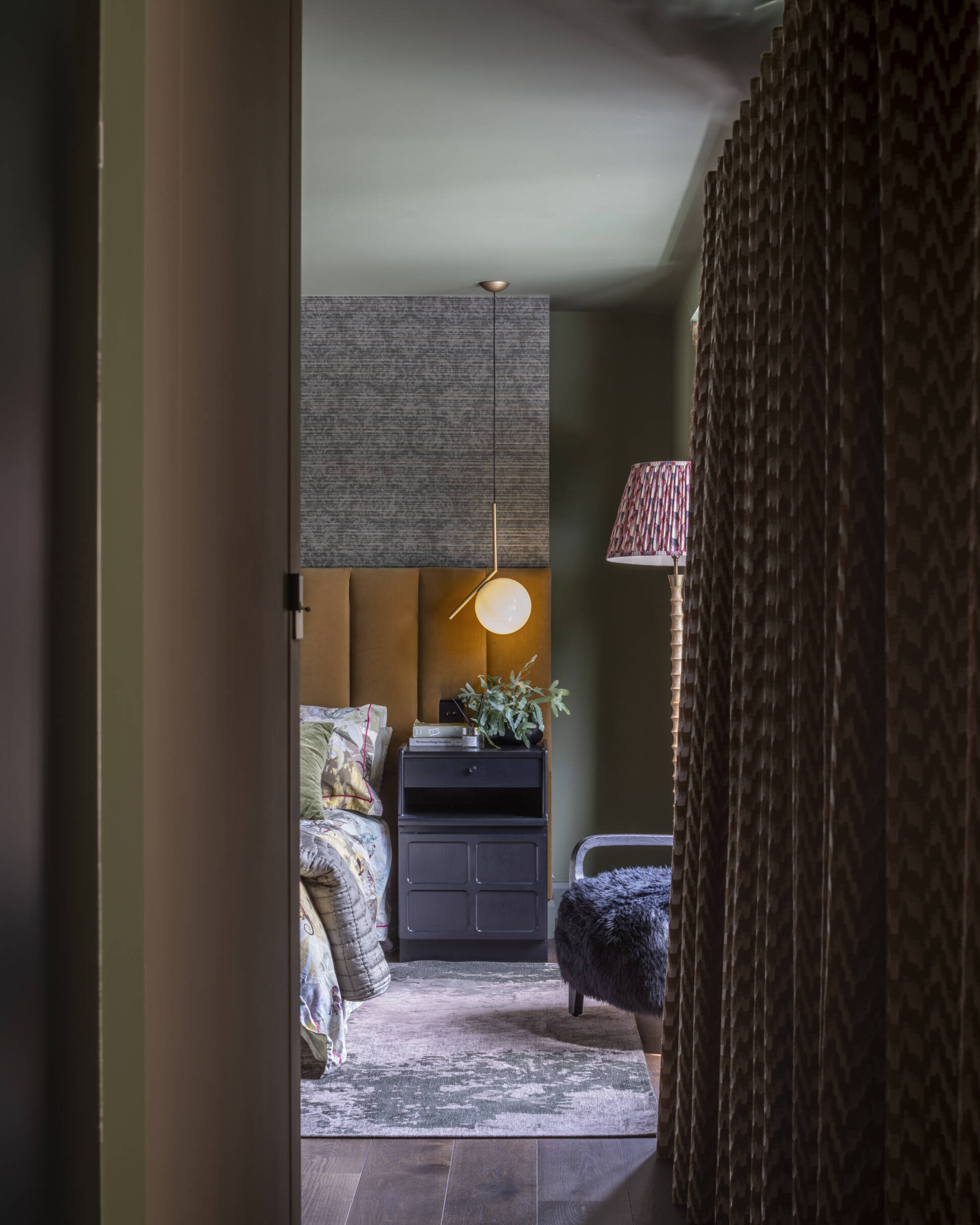 The main bedroom suite embodies comfort and calm. A walk-through closet leads to a serene ensuite bathroom, finished in soft tones that complement the home’s palette.