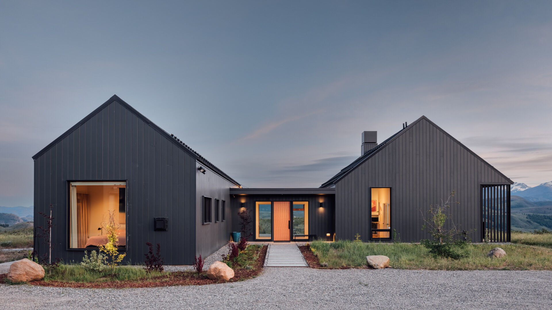 Two matte-black gabled volumes stand quietly against the Methow Valley landscape. The design by Syndicate Smith trades glass walls for carefully framed openings, creating a modern home that feels both grounded and deliberate.