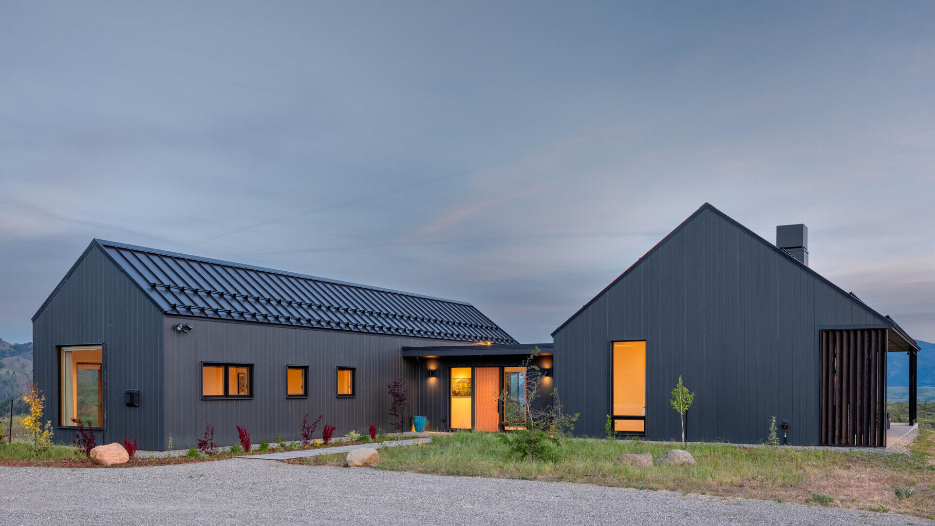 Two matte-black gabled volumes stand quietly against the Methow Valley landscape. The design by Syndicate Smith trades glass walls for carefully framed openings, creating a modern home that feels both grounded and deliberate.