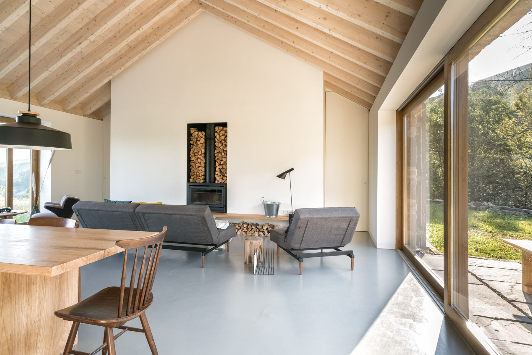 Warm wood, a fireplace, and minimalist decor make Villa Slow a place made for quiet moments.