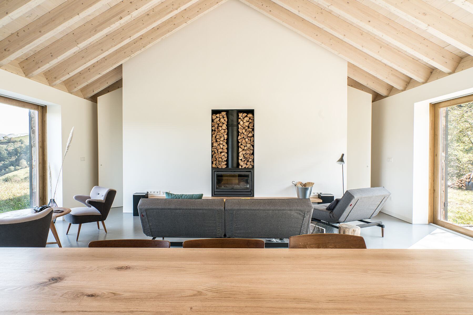 Warm wood, a fireplace, and minimalist decor make Villa Slow a place made for quiet moments.
