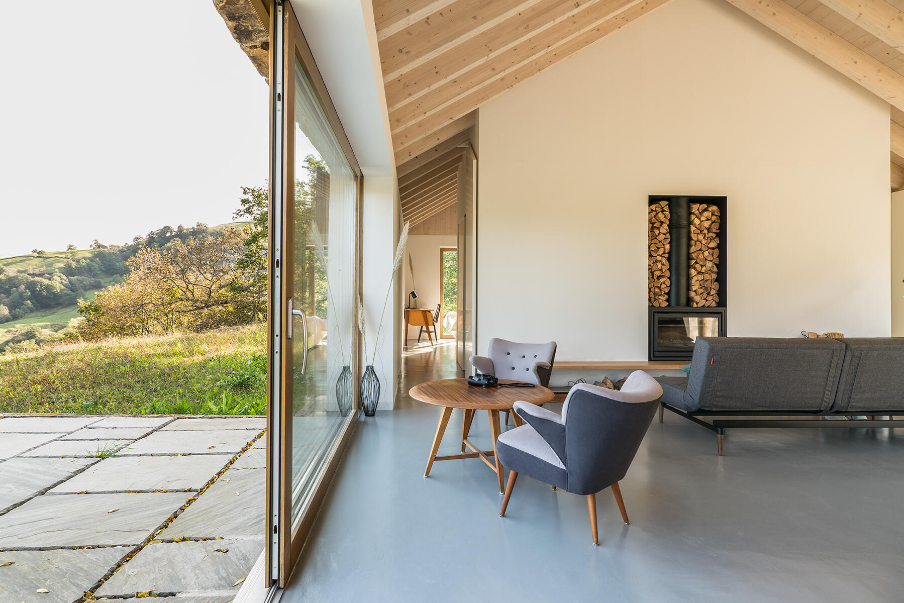 Warm wood, a fireplace, and minimalist decor make Villa Slow a place made for quiet moments.
