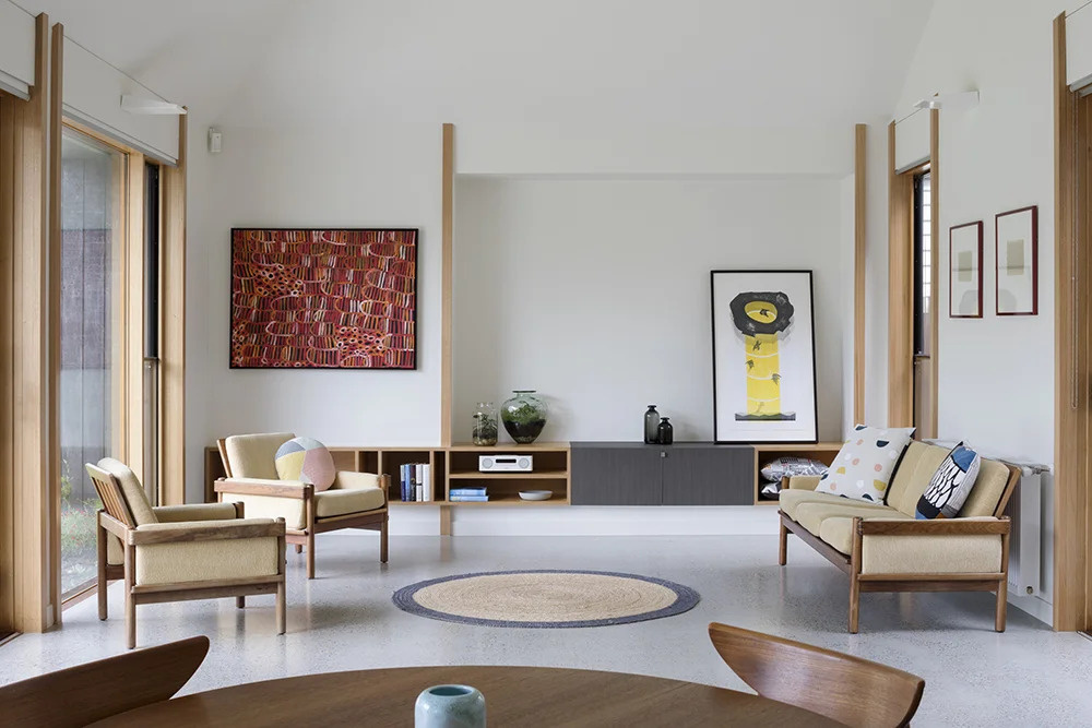 Open-plan living flows seamlessly to the outdoors, with sliding doors and timber details tying the whole home together.