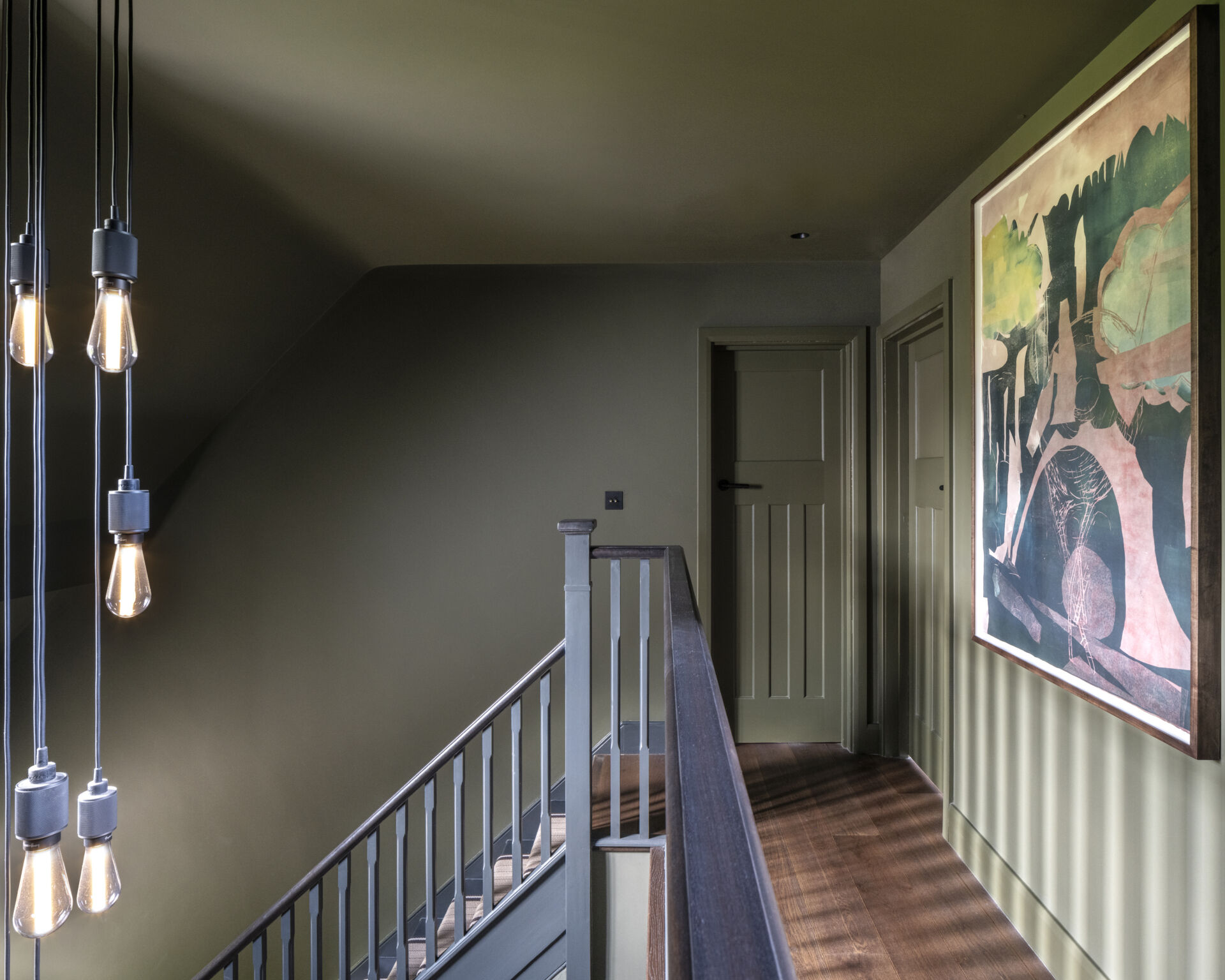 The foyer’s original staircase now glows with natural light, blending old craftsmanship with modern warmth.