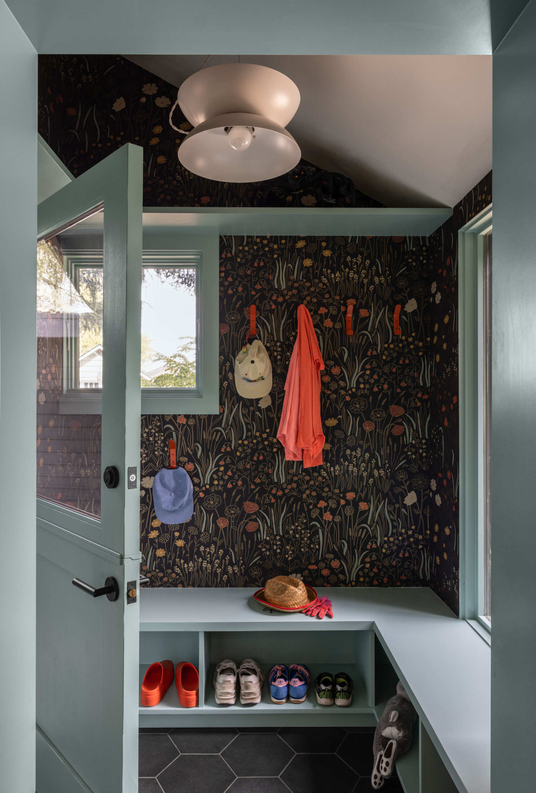 A new mudroom creates a welcoming buffer between the outdoors and the vibrant family home.