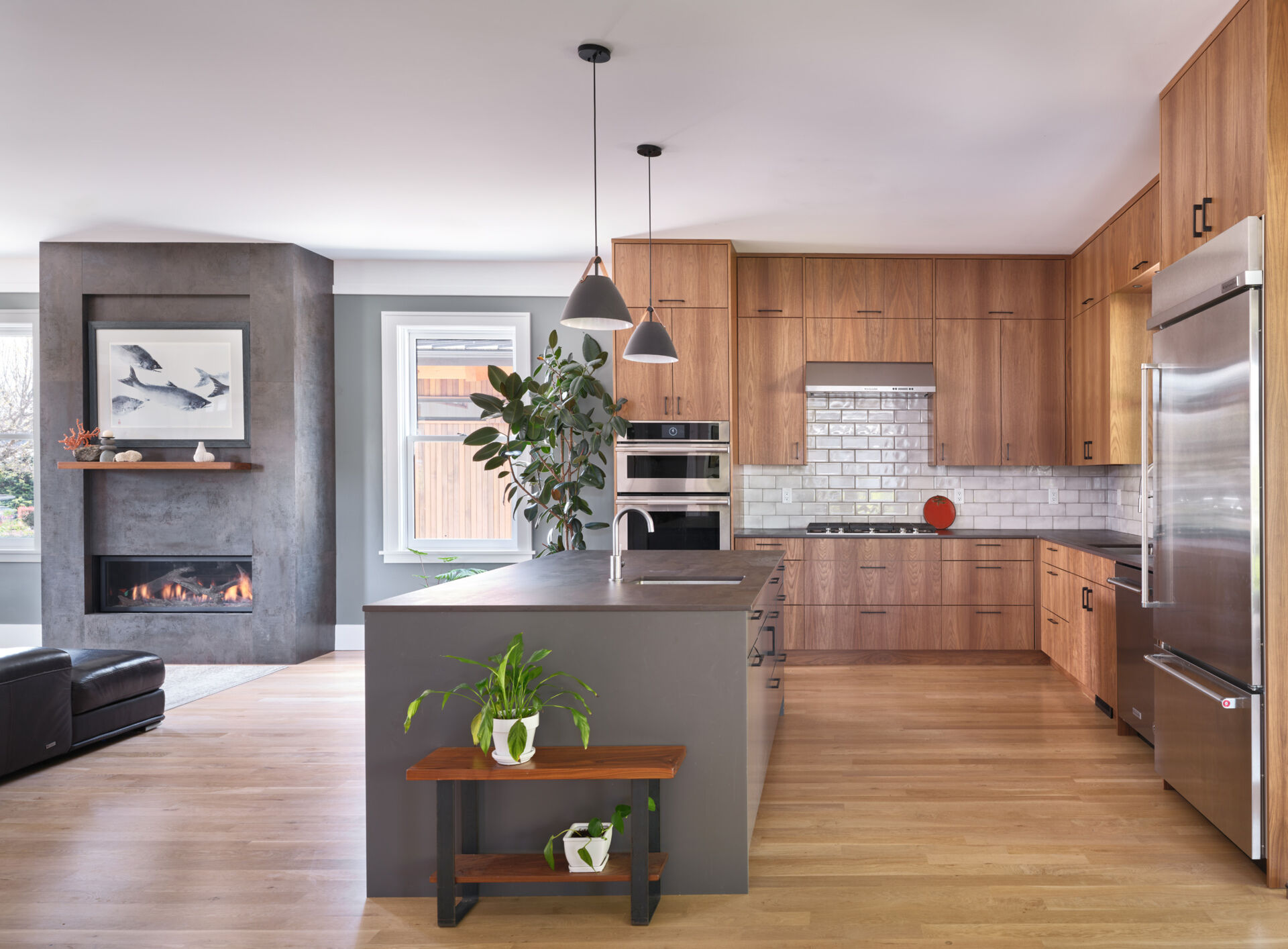 A modern wood kitchen with a large island.