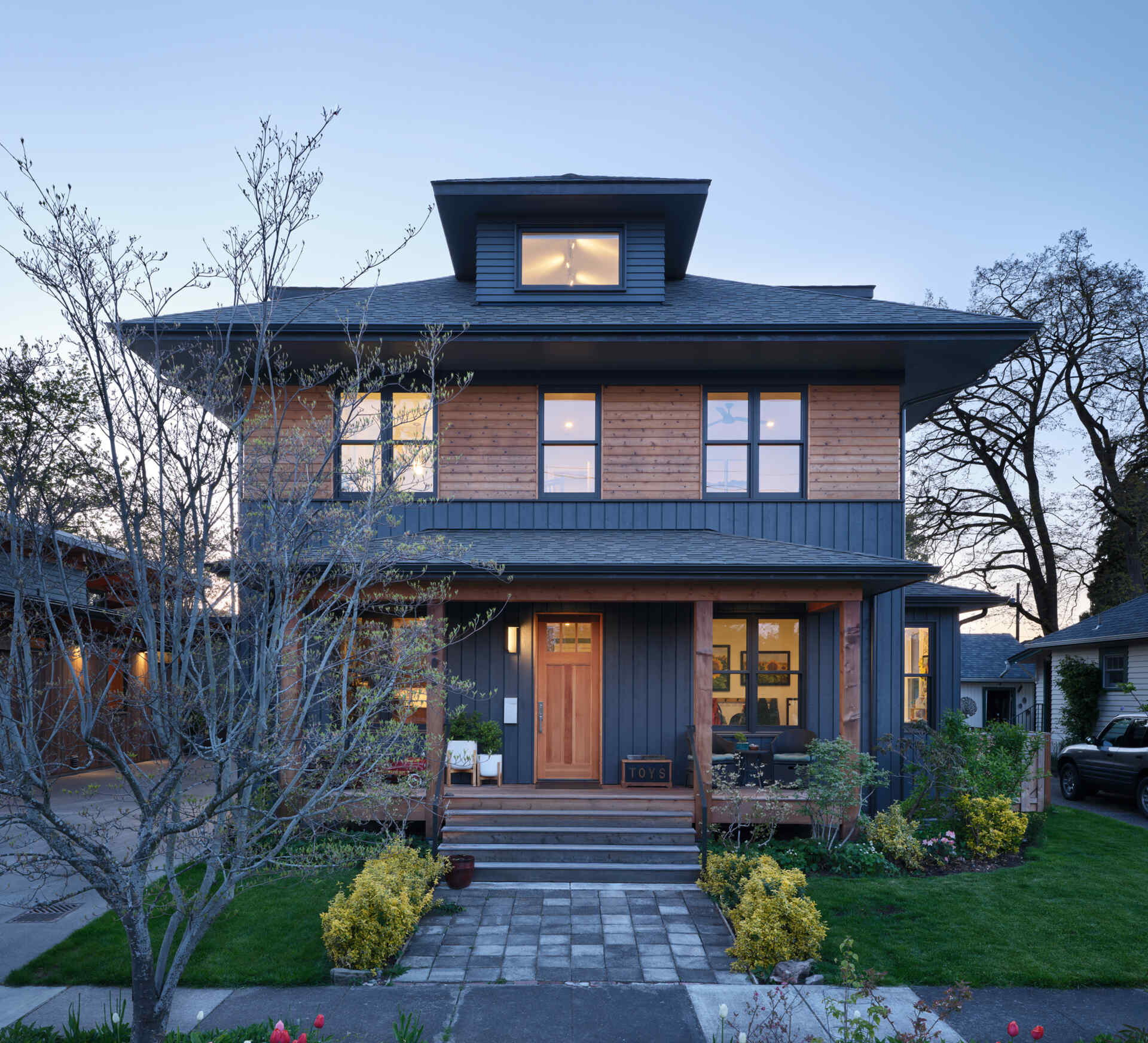 A young family built two modern homes, personally acting as general contractors, blending contemporary design with tradition.
