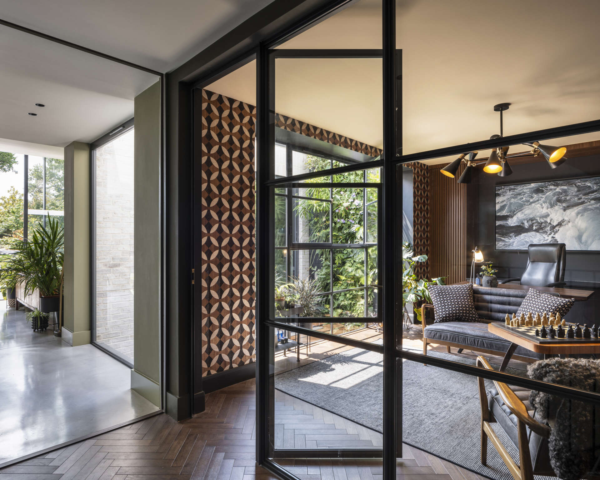 The home office overlooks the courtyard, designed as a serene and inspiring space for focused work.