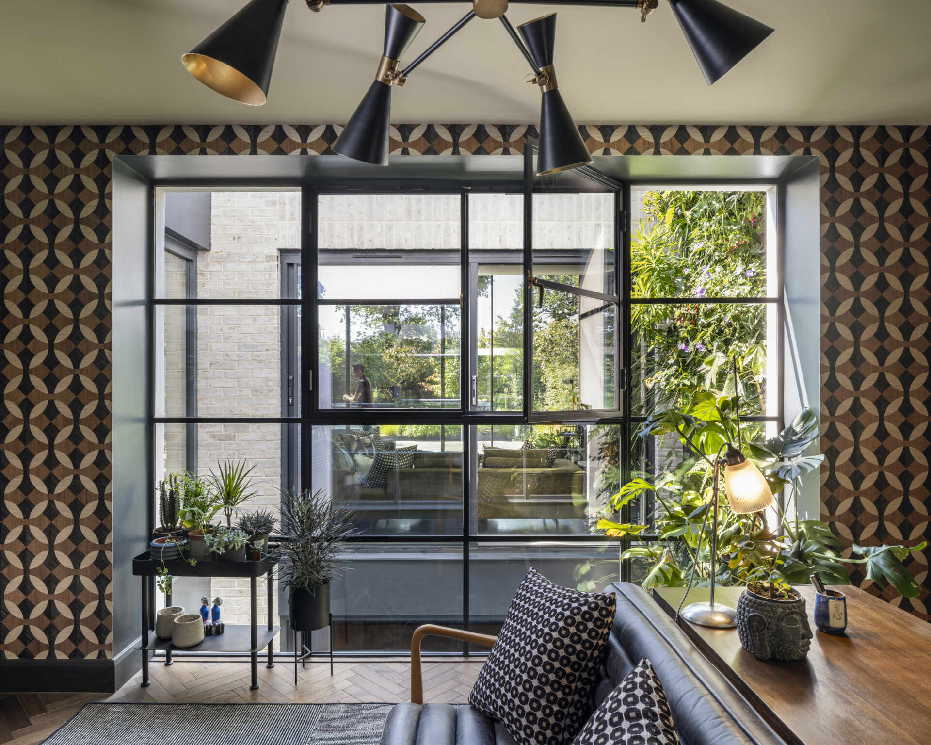 The home office overlooks the courtyard, designed as a serene and inspiring space for focused work.