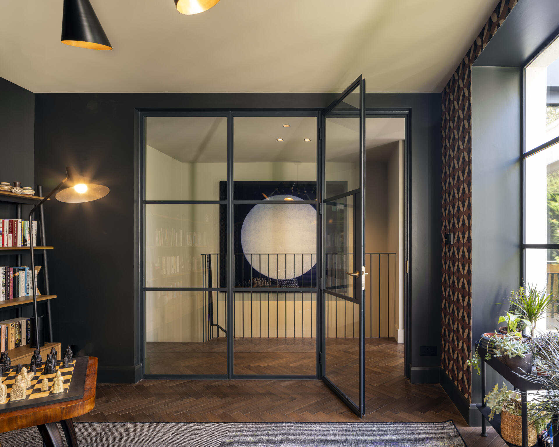 The home office overlooks the courtyard, designed as a serene and inspiring space for focused work.