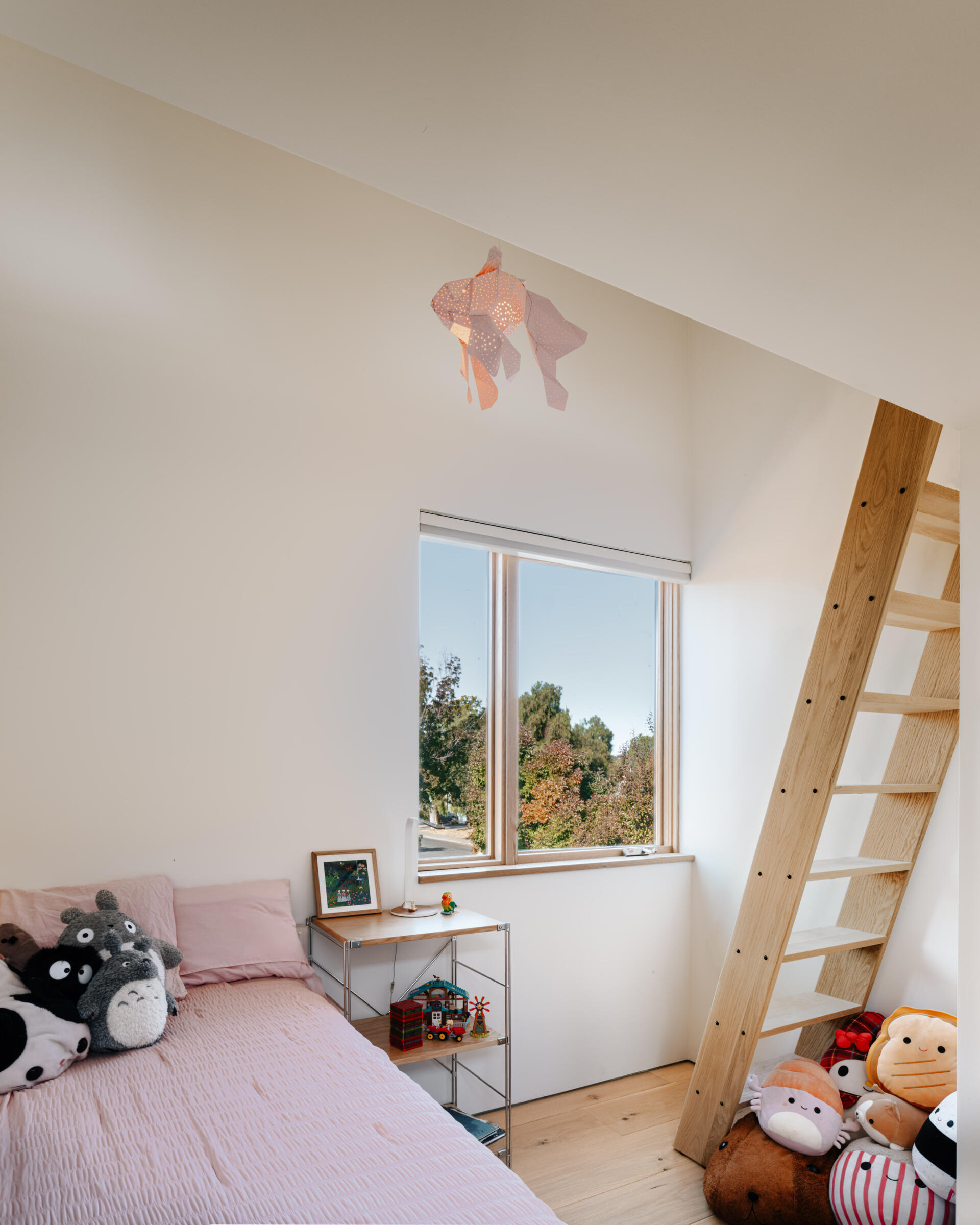 This kids bedroom features a loft to maximize play and storage. 