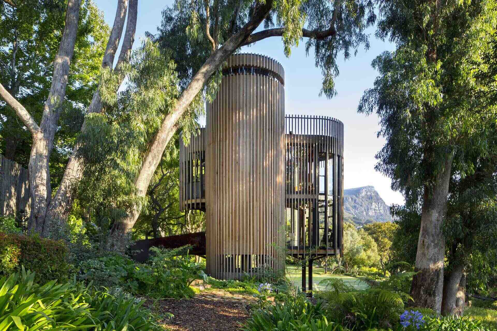 A tree house in Cape Town’s Constantia designed to weather naturally, blending untreated materials with the forest around it.
