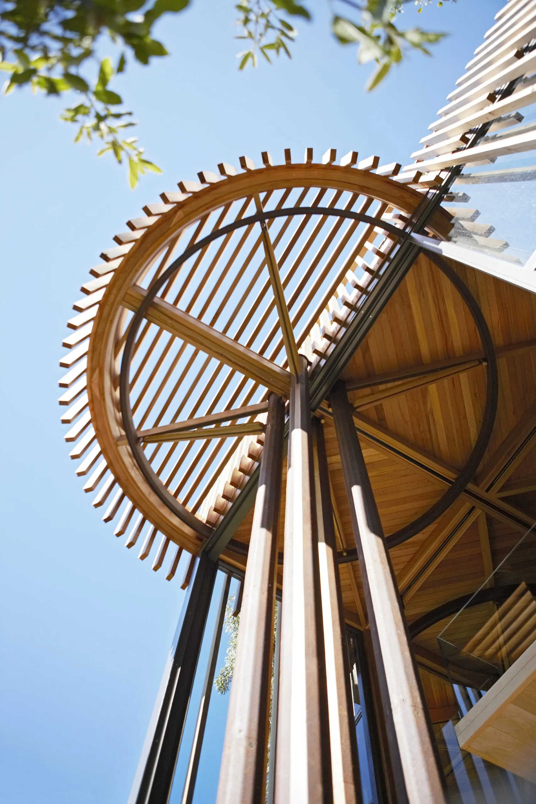 A pin-wheel layout of squares and circles creates harmony between architecture and nature.