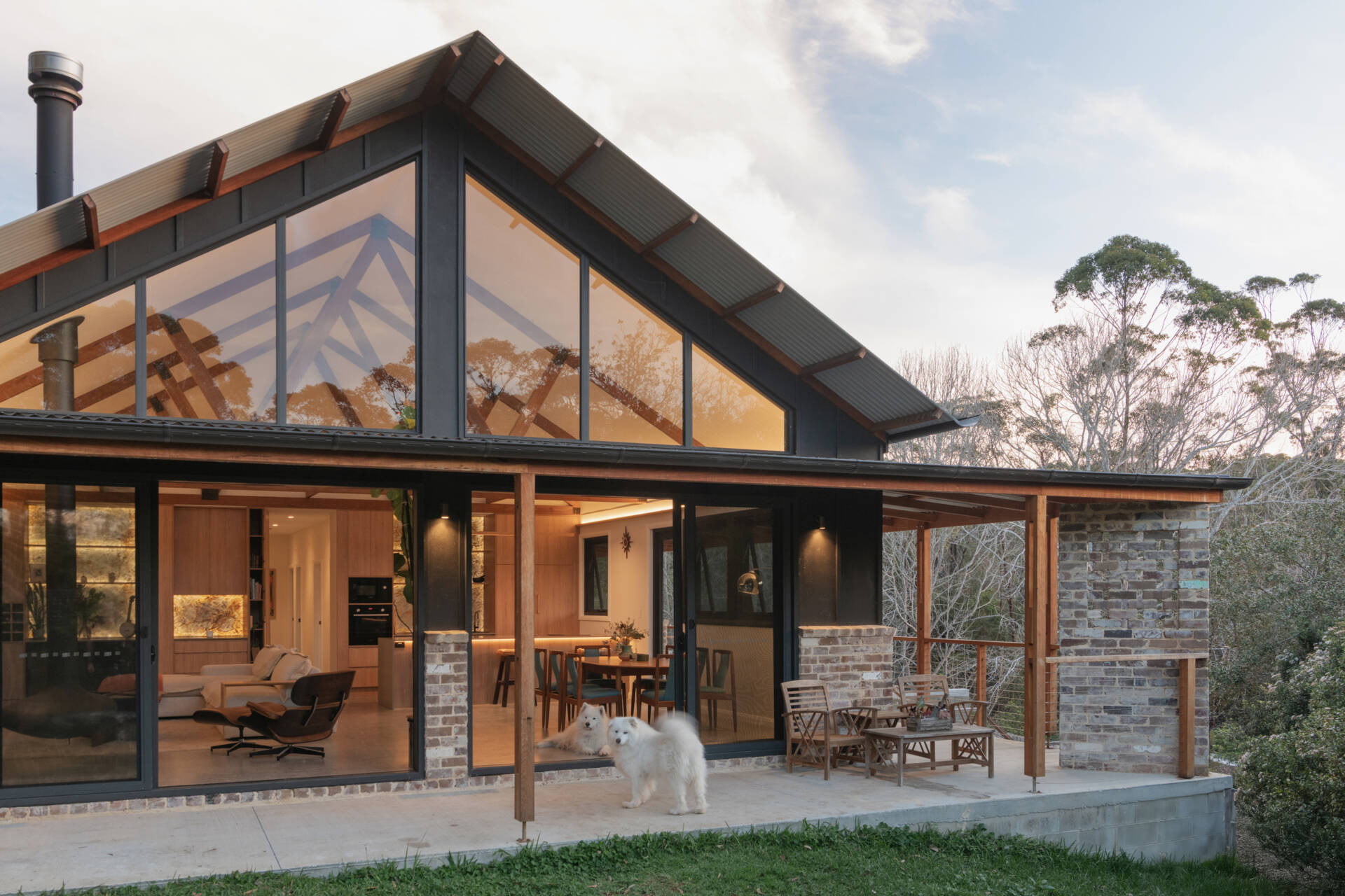 Wrapped in natural hardwood and anchored by polished concrete, the home’s palette feels warm, tactile, and enduring. Each surface works hard, weathering gracefully outdoors and grounding the interiors within.
