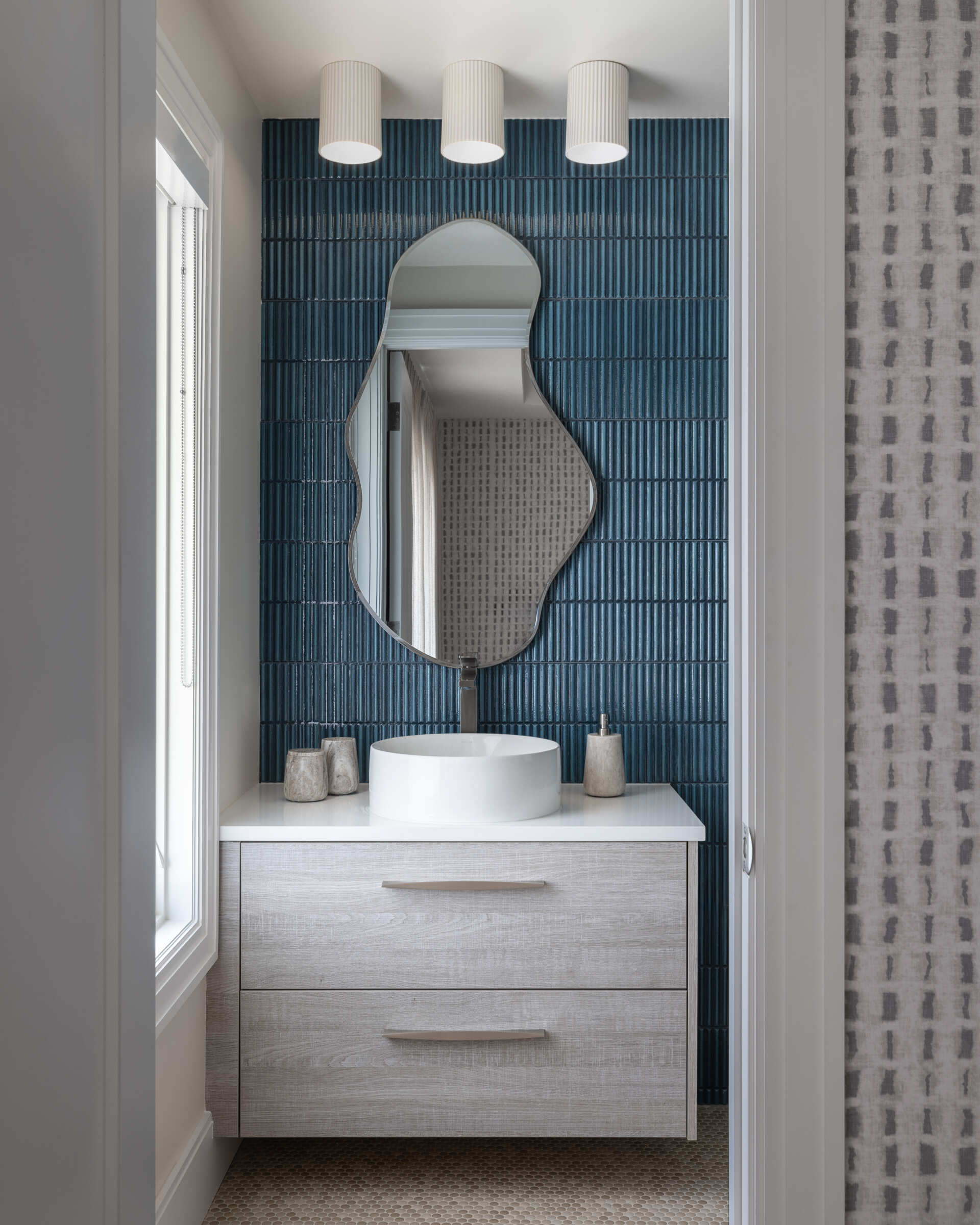 Guest and family baths repeat the language. Sleek fixtures, softly veined surfaces, great light. Everything in its place, nothing fighting for attention. The result is spa-level calm on every floor.