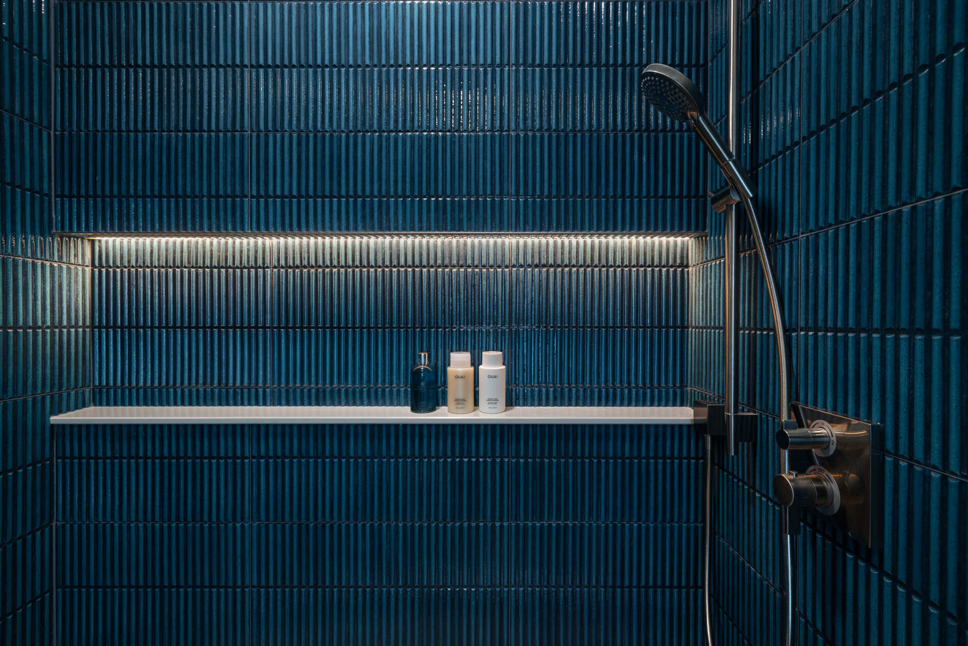 Guest and family baths repeat the language. Sleek fixtures, softly veined surfaces, great light. Everything in its place, nothing fighting for attention. The result is spa-level calm on every floor.
