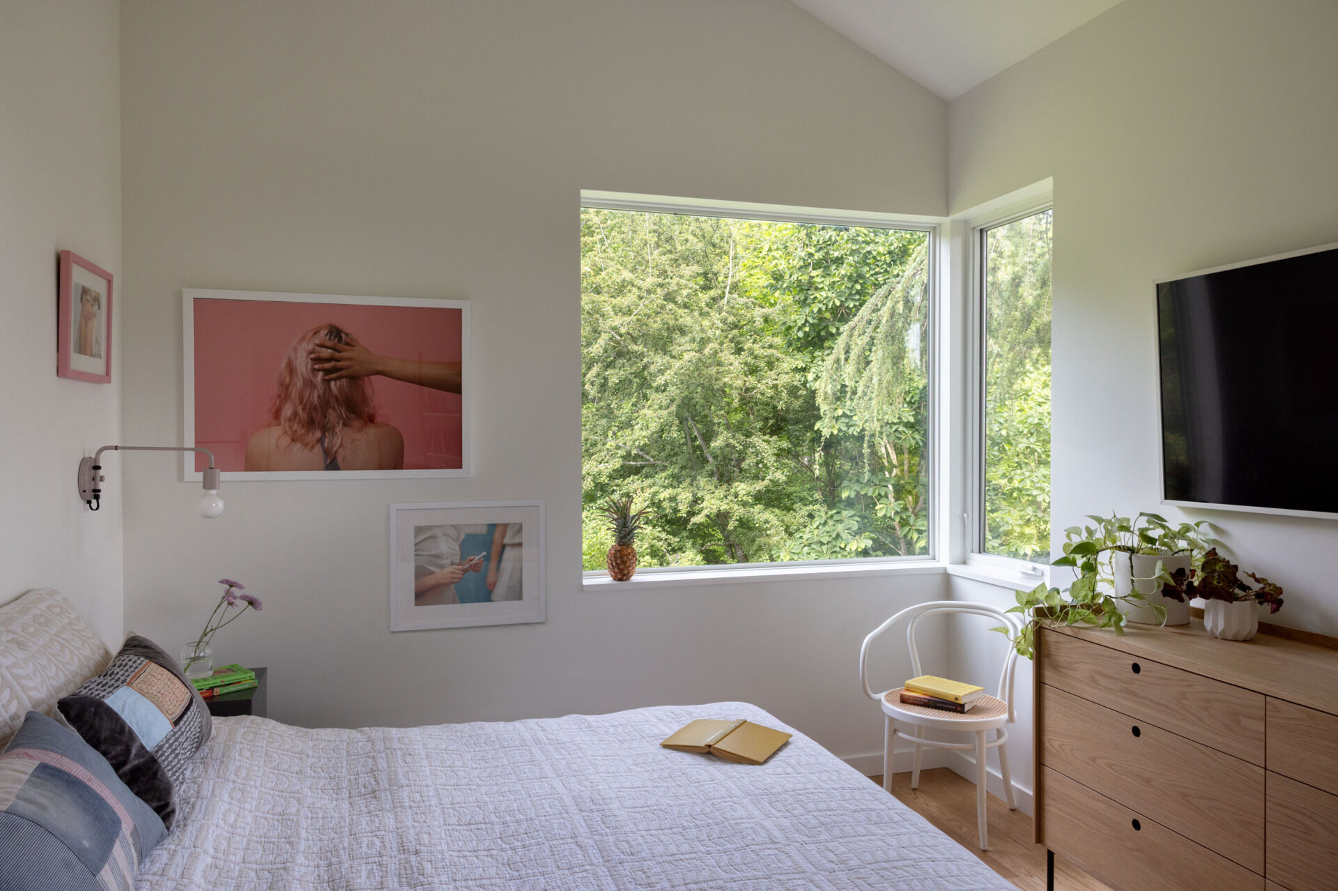 The new bedroom enjoys treetop and lake views while offering privacy and comfort.