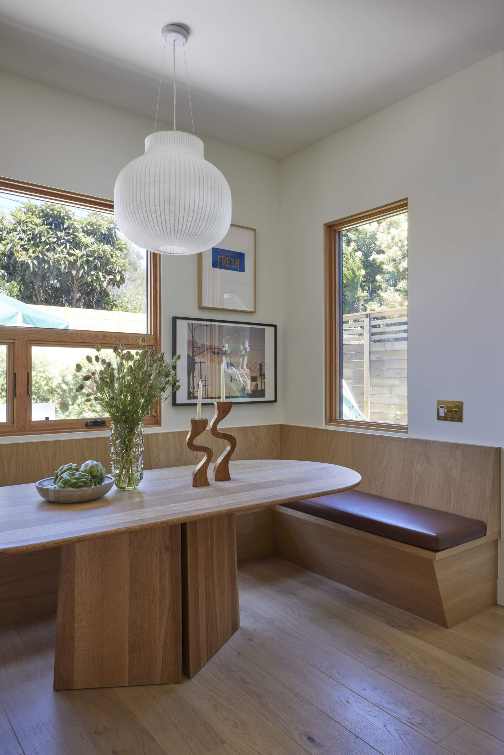 A cozy banquette transforms the dining nook into a perfect spot for family meals, designed to maximize space without sacrificing comfort.