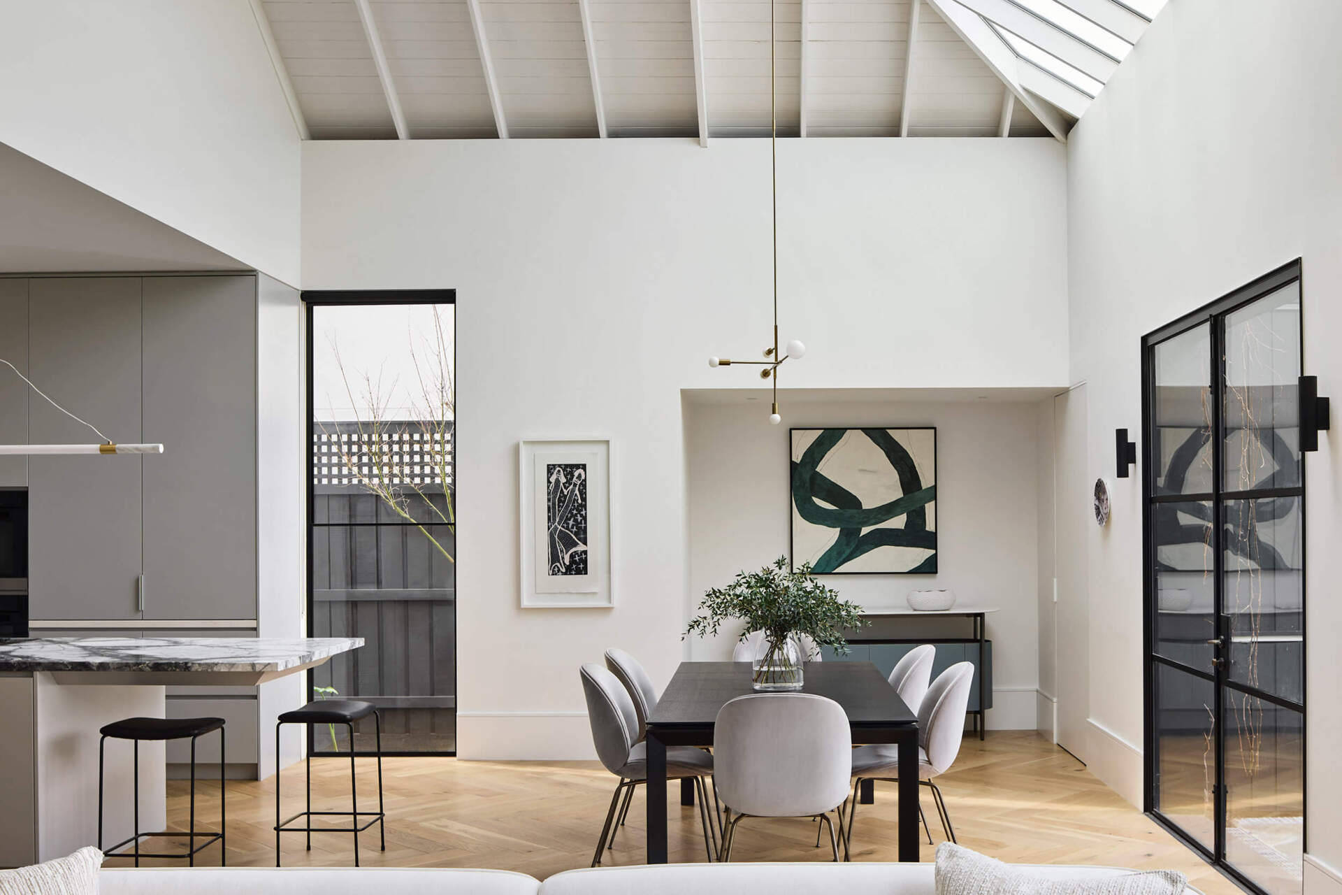 Open-plan living and dining bring warmth and refinement to this Australian family home.