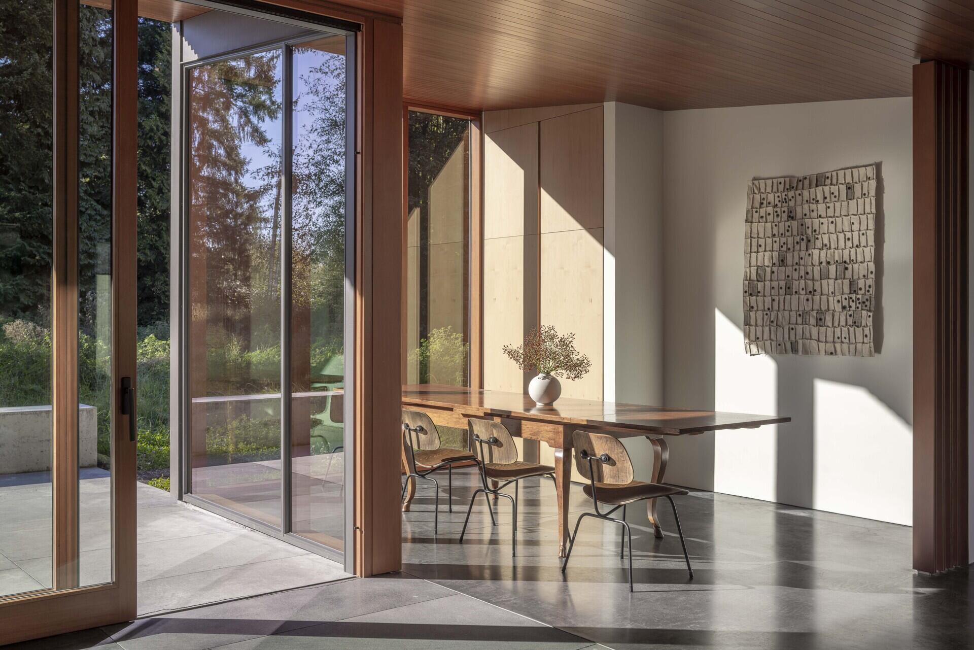Inside, natural materials and handmade details tell a personal story. Locally sourced fir and cedar, terrazzo, and radiant concrete floors create a warm, practical backdrop for art, craft, and quiet reflection.