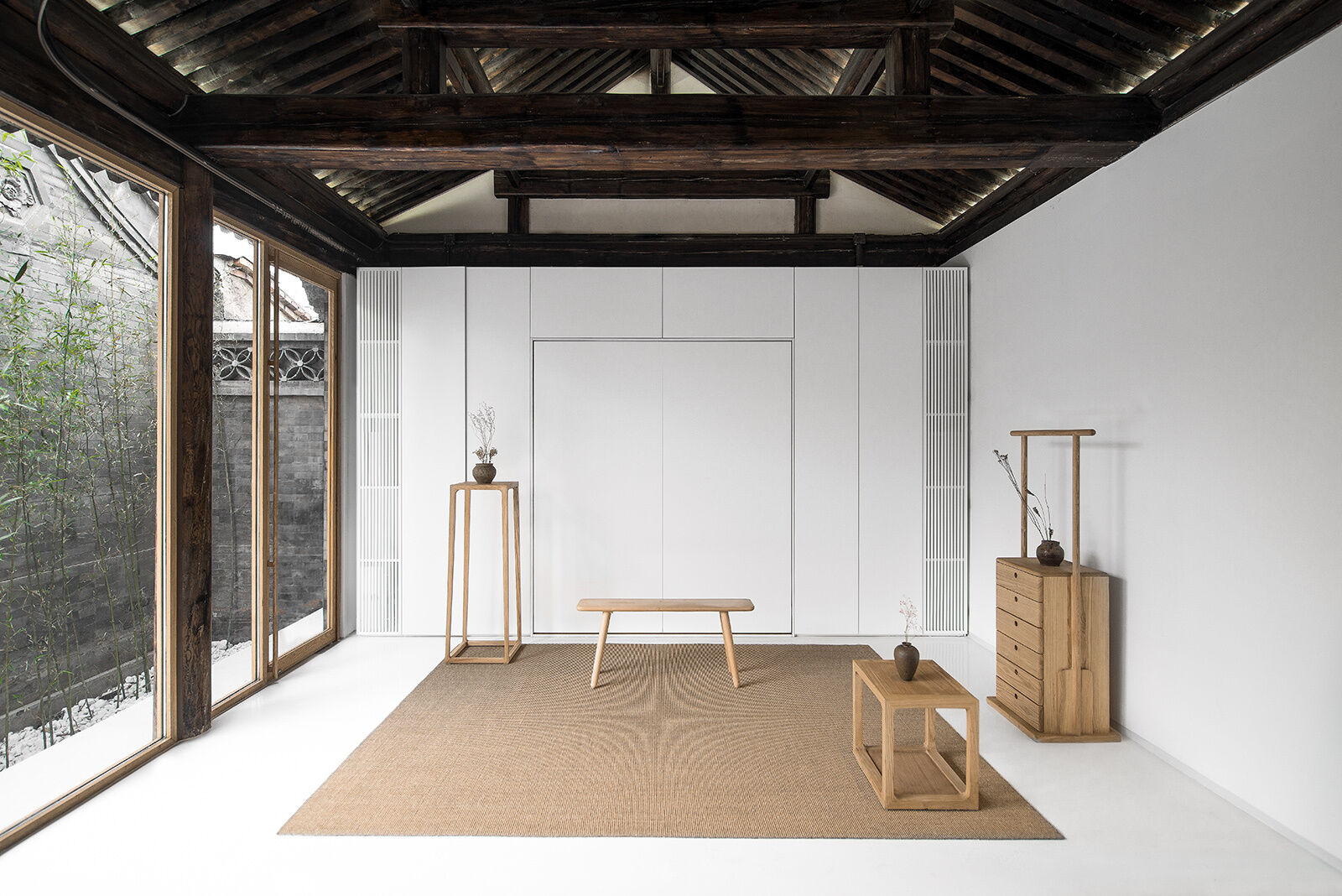 Pull-down beds hidden in furniture boxes transform leisure areas into restful sleeping spaces as needed.