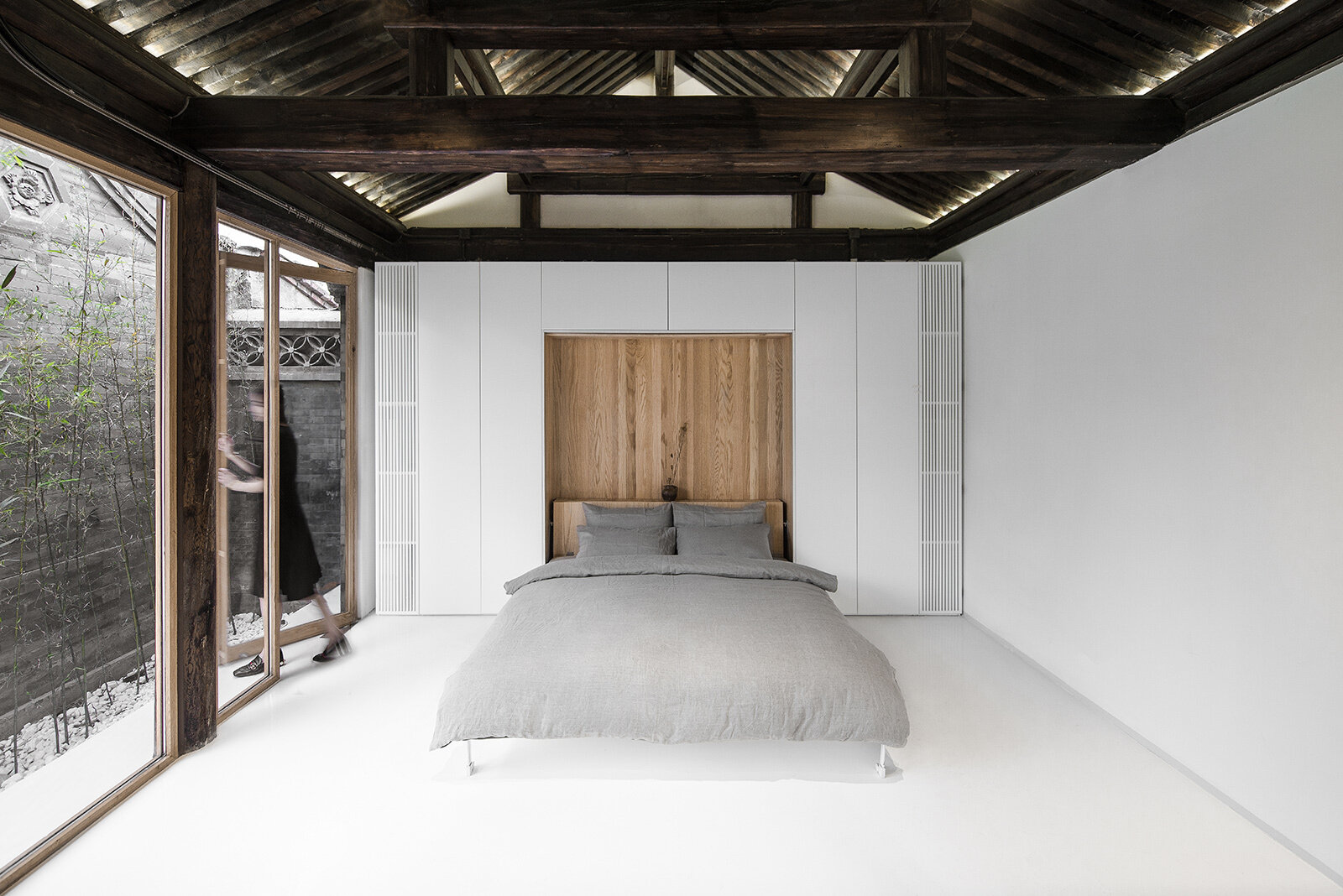 Pull-down beds hidden in furniture boxes transform leisure areas into restful sleeping spaces as needed.