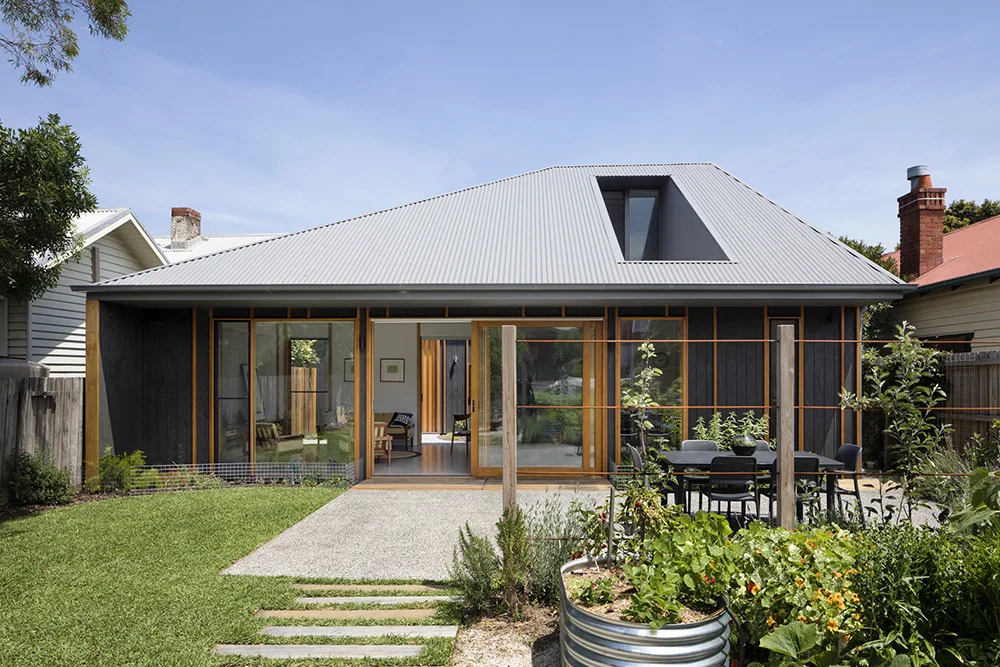 A backyard built for relaxing and entertaining, with a hidden second floor that reveals the home’s clever design.