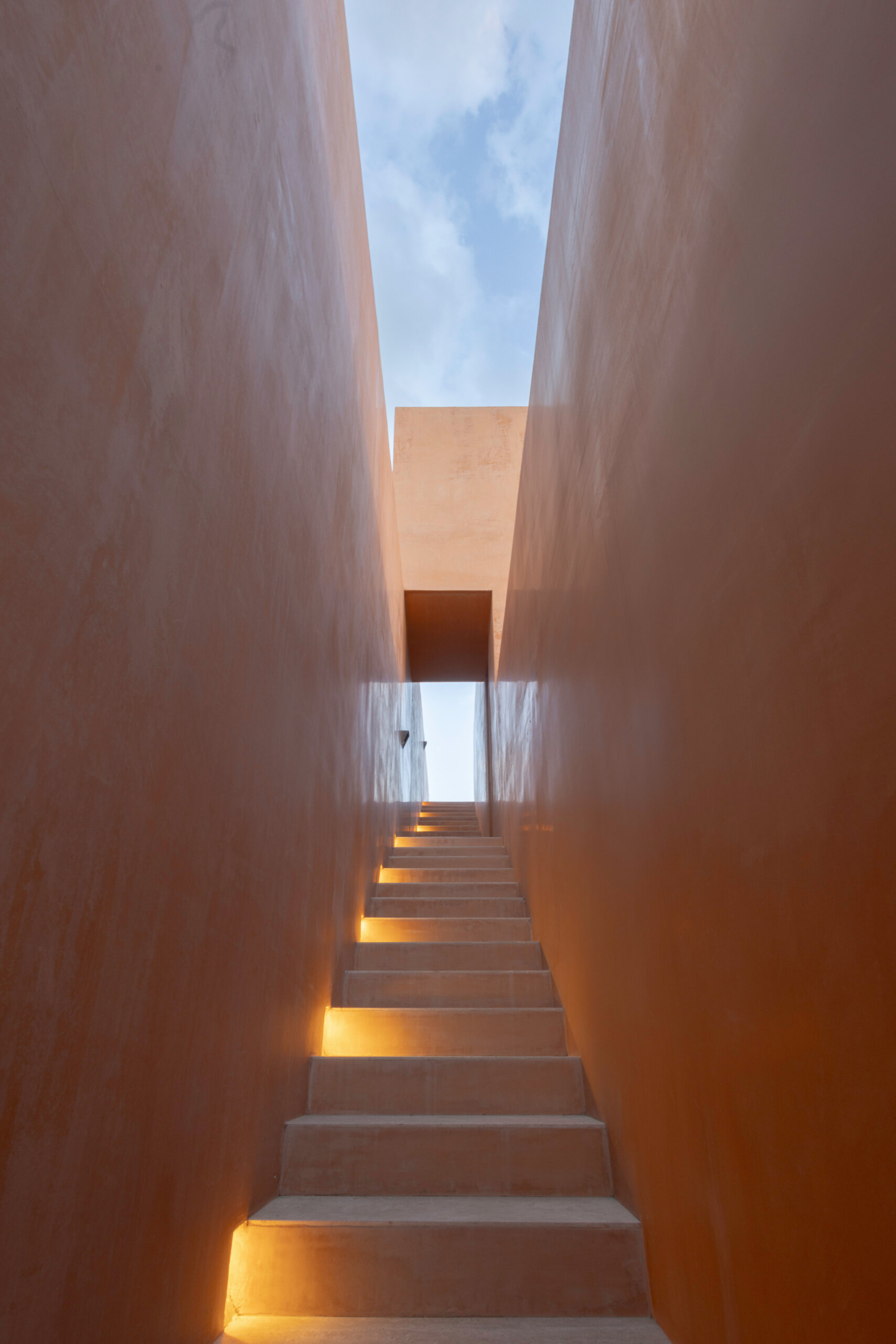 A continuous staircase leads to the second unit and rooftop.