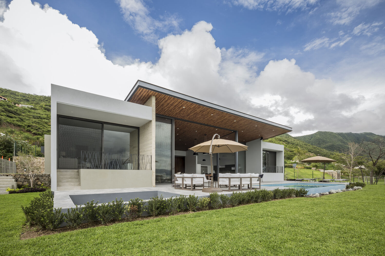 Overlooking Lake Chapala, this hillside home by FARQ Arquitectos combines natural materials and stunning views for year-round comfort.