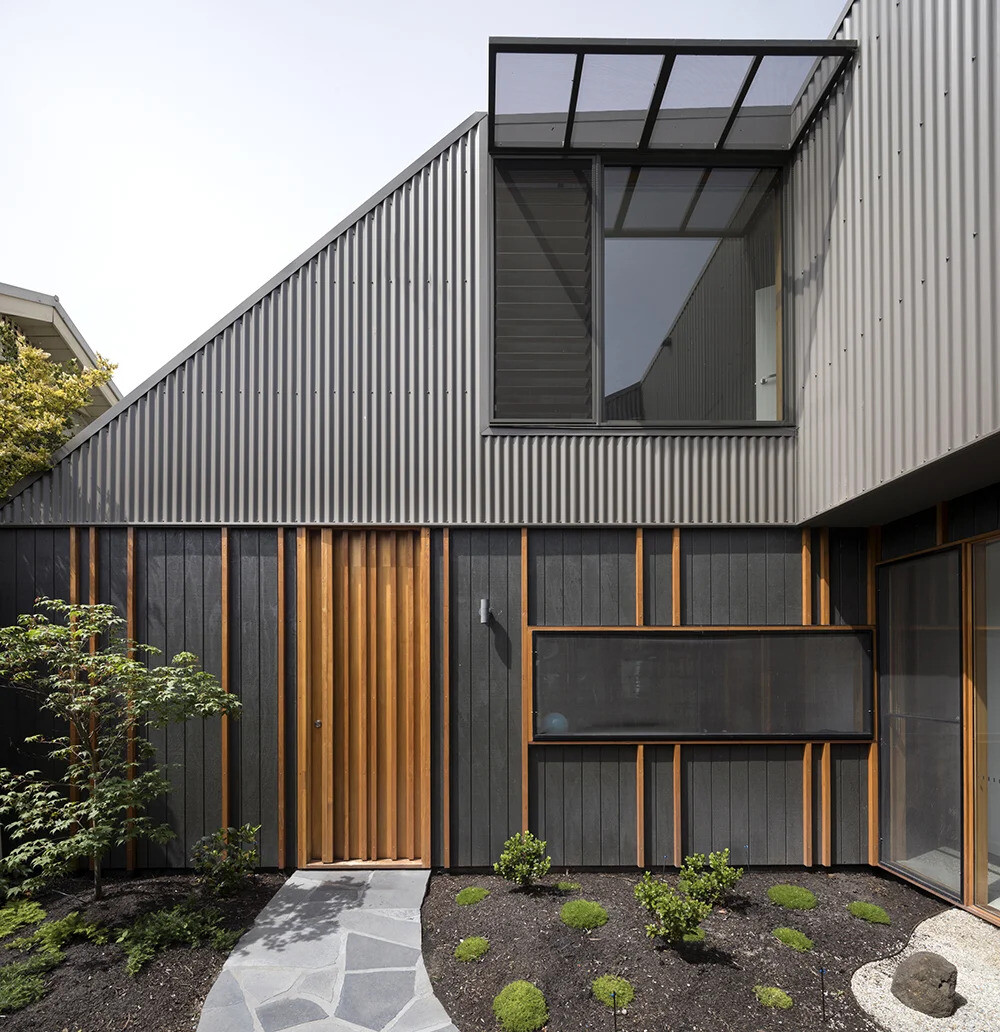 A sculptural twist on the classic suburban roofline gives this Melbourne home a modern identity while staying true to its neighborhood charm.