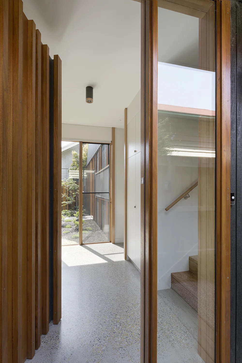 A sculptural twist on the classic suburban roofline gives this Melbourne home a modern identity while staying true to its neighborhood charm.