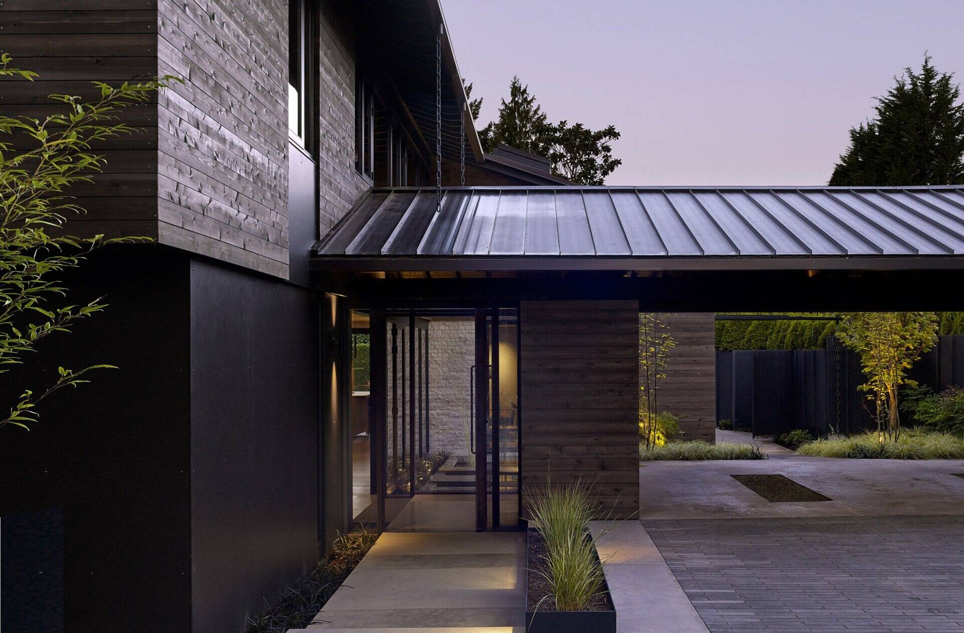 This renovated midcentury home blends 1960s charm with modern updates, featuring floor-to-ceiling glass, radiant heating, and a tranquil central courtyard.