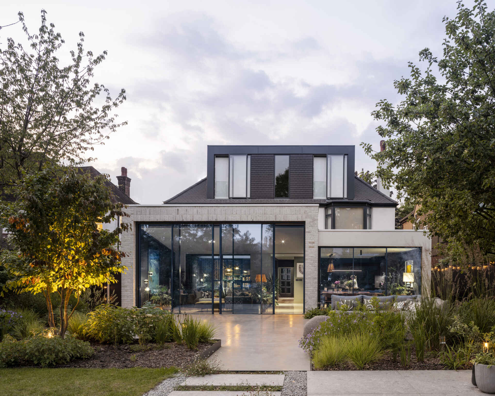 The new extension floods the home with daylight, creating a seamless link between the house and garden.