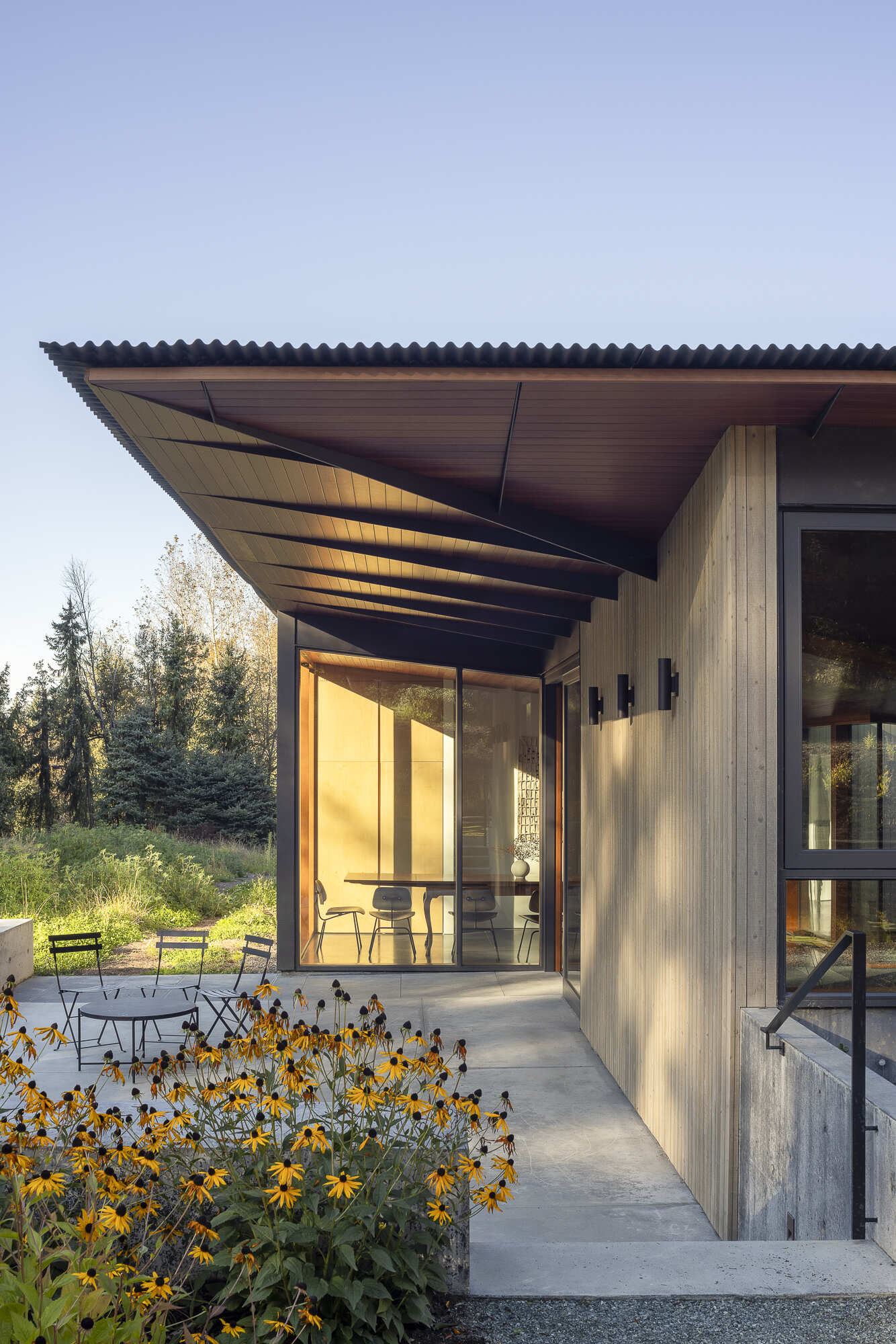 Reflecting pools, rain-fed gardens, and native plantings weave this home into its natural setting. Inspired by an ancient Roman impluvium, water cascades from broad eaves into shallow pools, turning rainfall into a living, ever-changing landscape.
